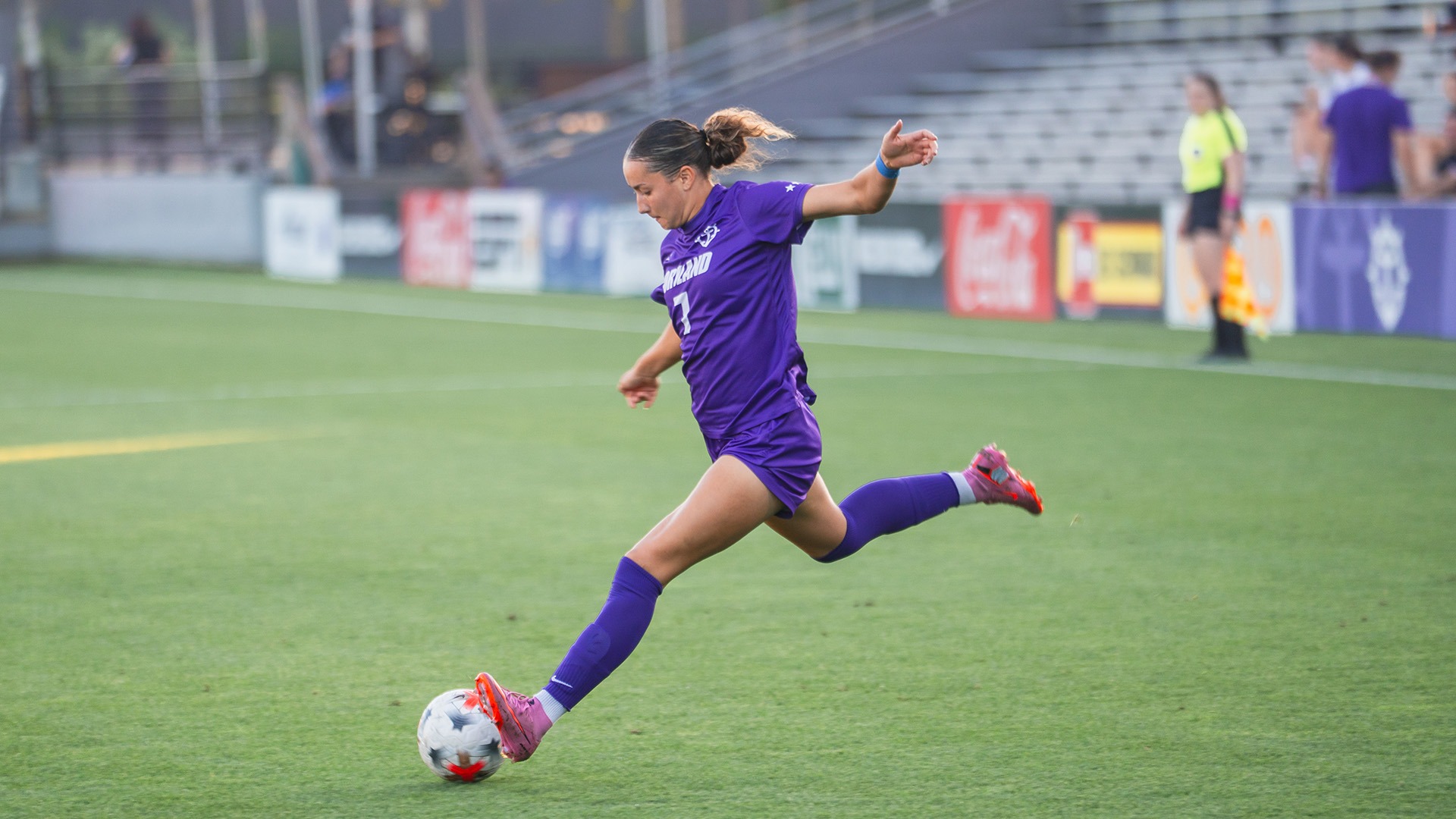 Xayla Black kicks the ball towards goal.
