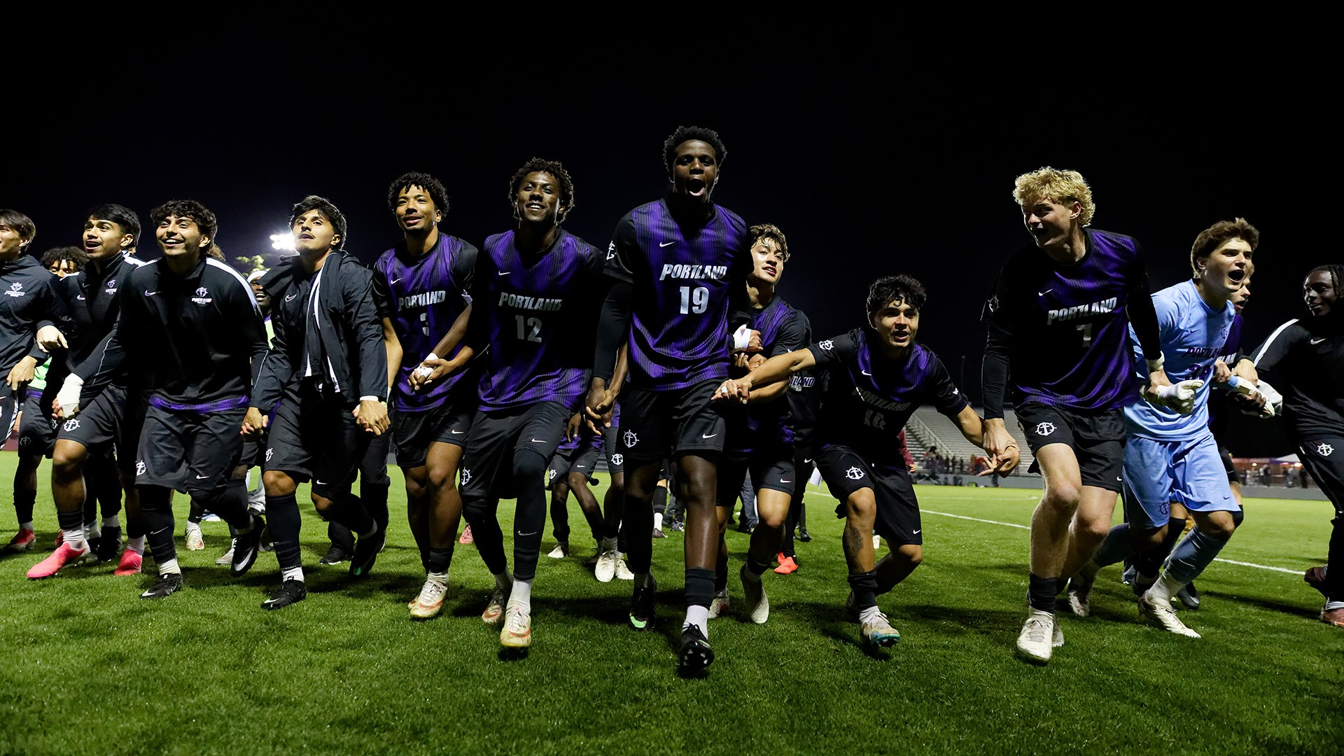 David Ajagbe and company celebrate a big win over Denver.