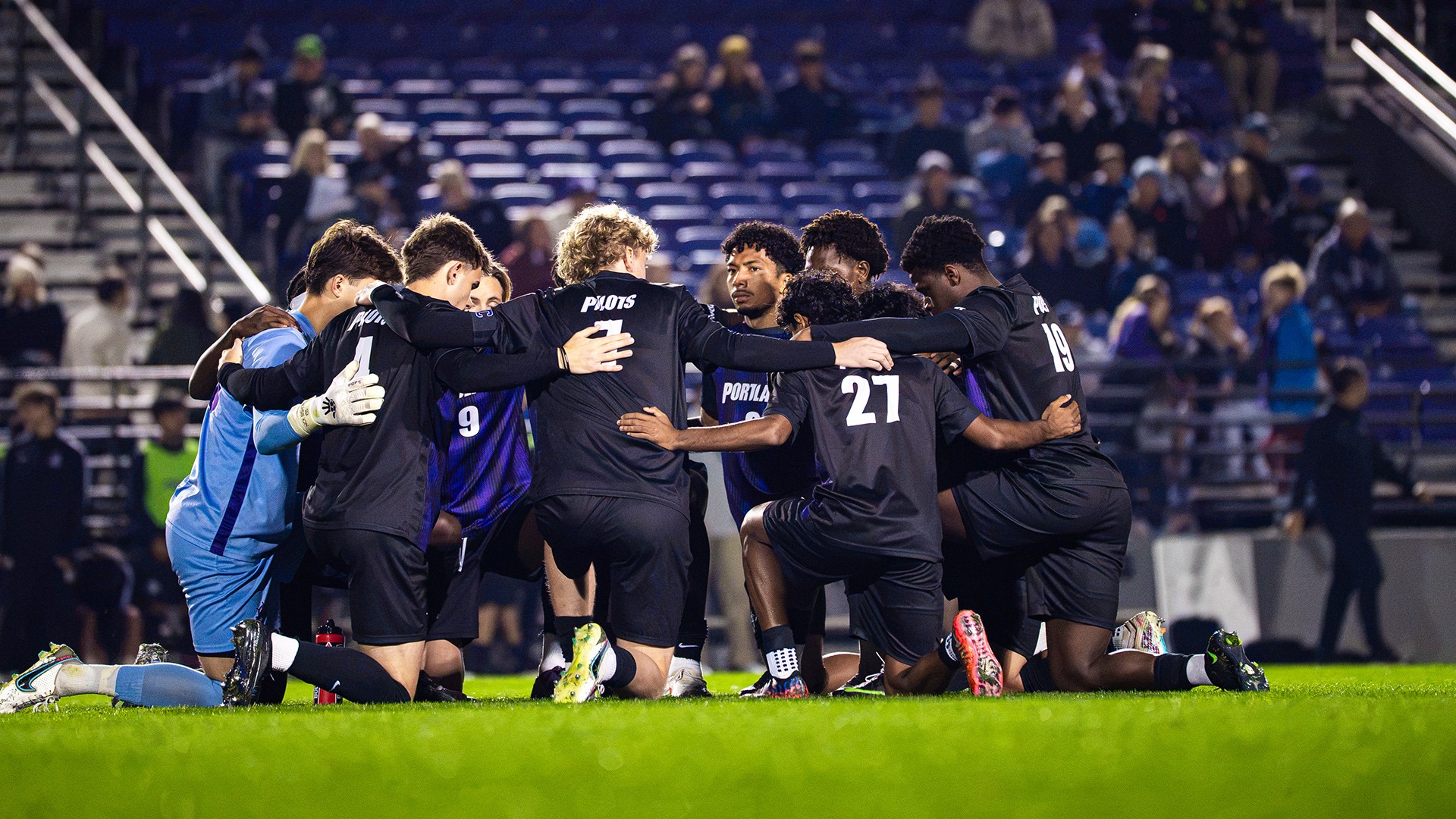 The men's soccer team huddles up before their match against Denver.