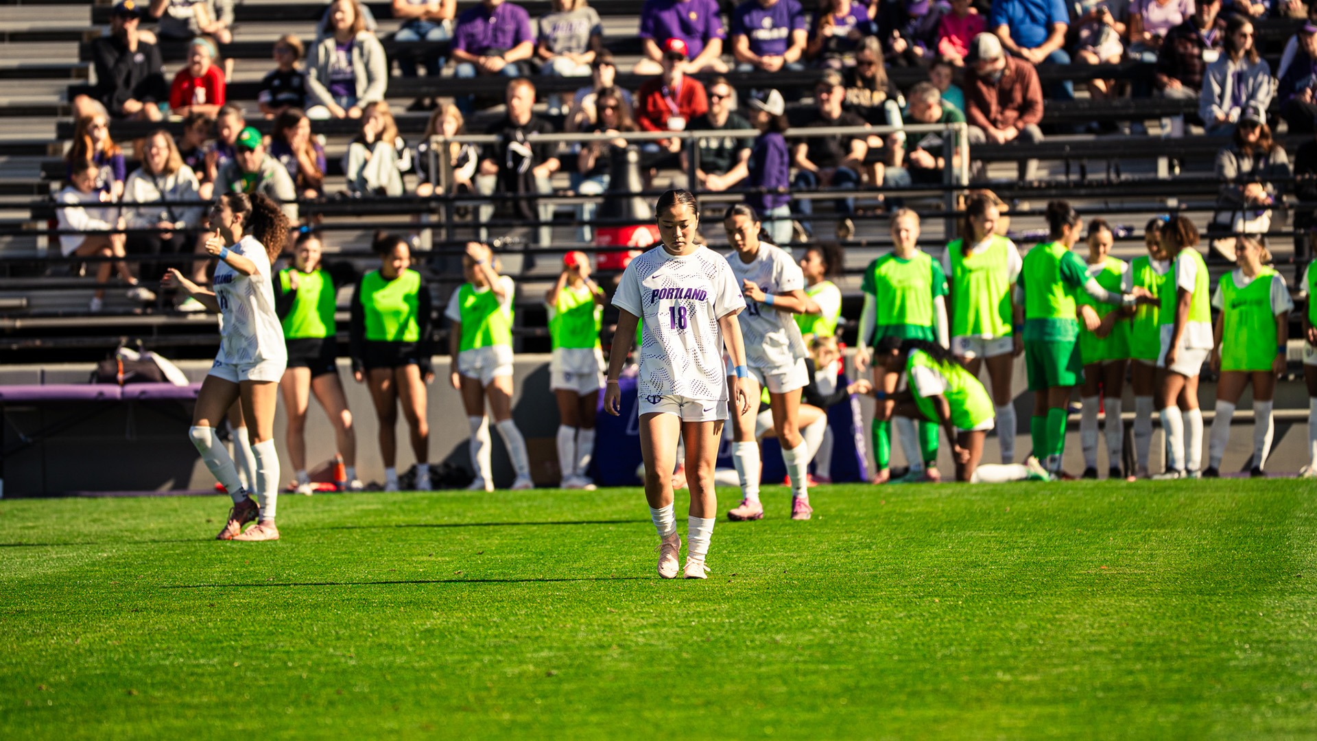 Mao Ito walks the field.