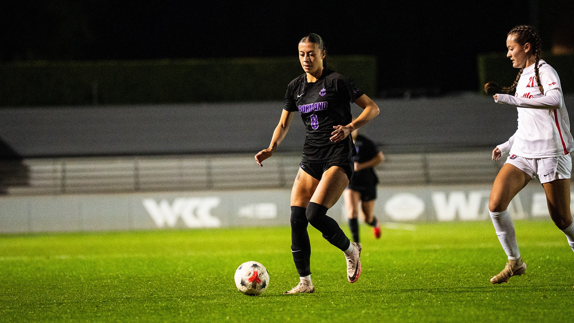 Talia Niebles-Webb dribbles through the midfield.