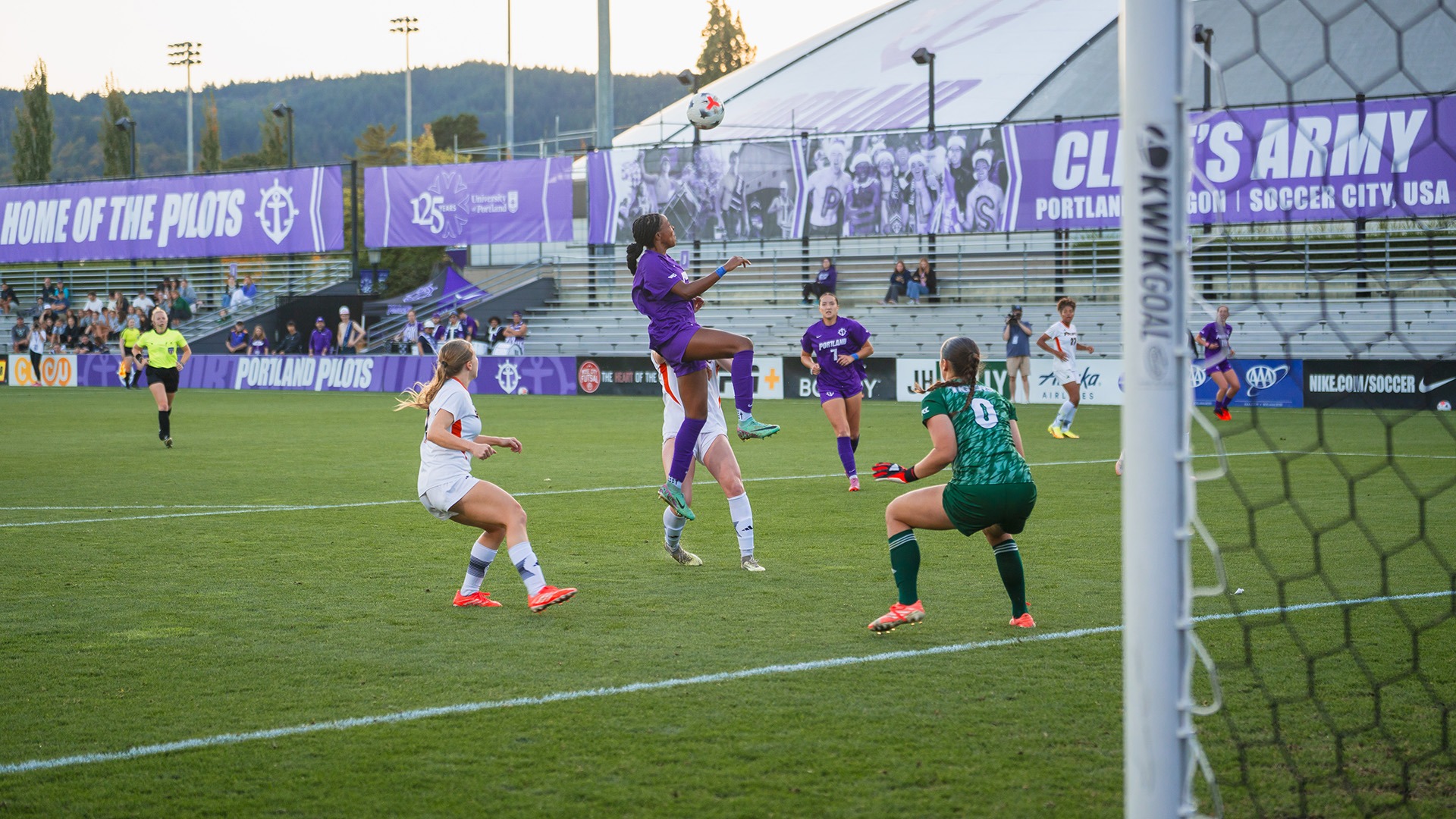 Jordyn Womack rises to head it in against Pacific.
