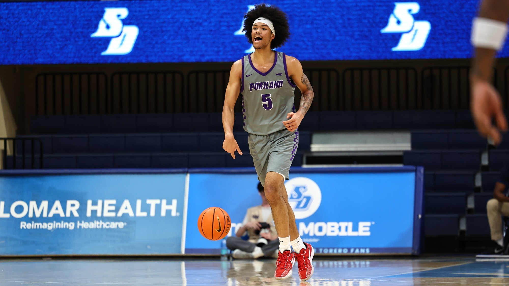 Dante Censori-Hercules brings the ball up the court in a road game at San Diego.
