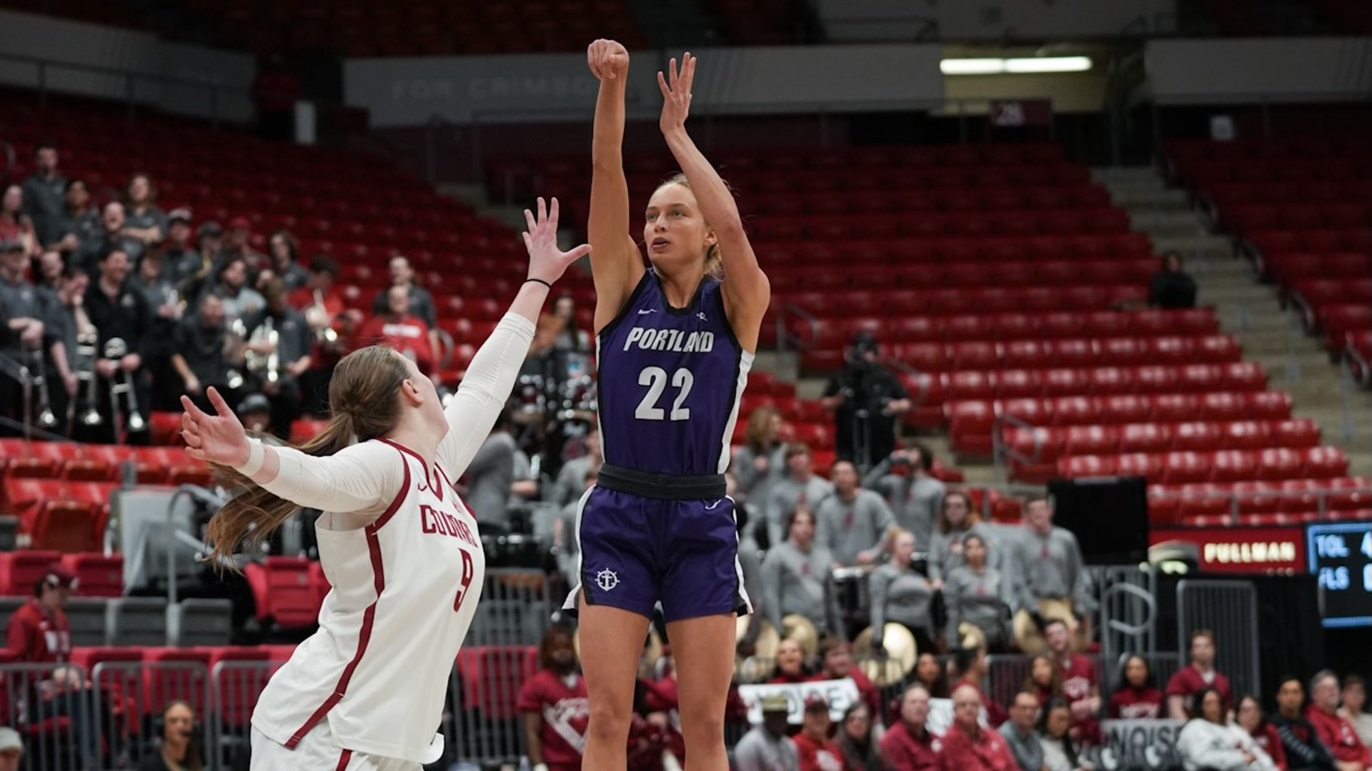 Rhyan Mogel shoots a 3-pointer over a Washington State defender.