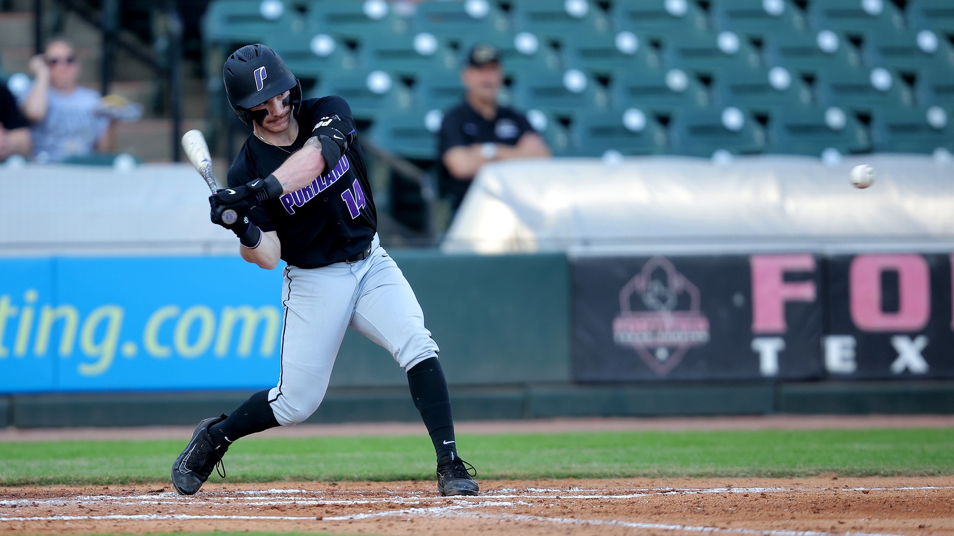 Jonas Salk takes a swing against Purdue.