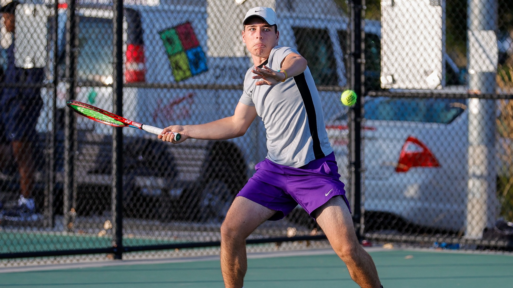 Lucas Kimelman hits a forehand during a road singles match.