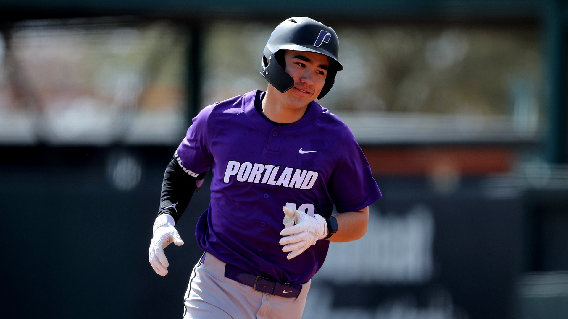 Cole Katayama-Stall smiles after hitting a home run.