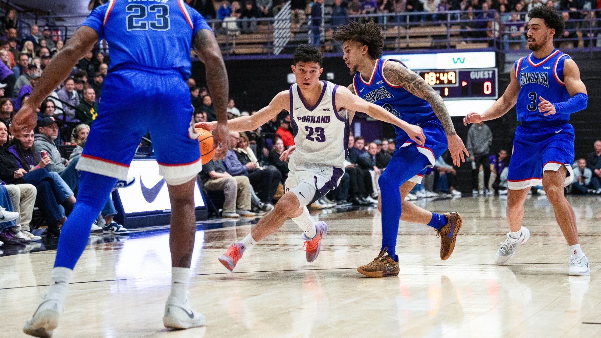 Joel Foxwell drives through the Gonzaga defense in a home game at Chiles Center.