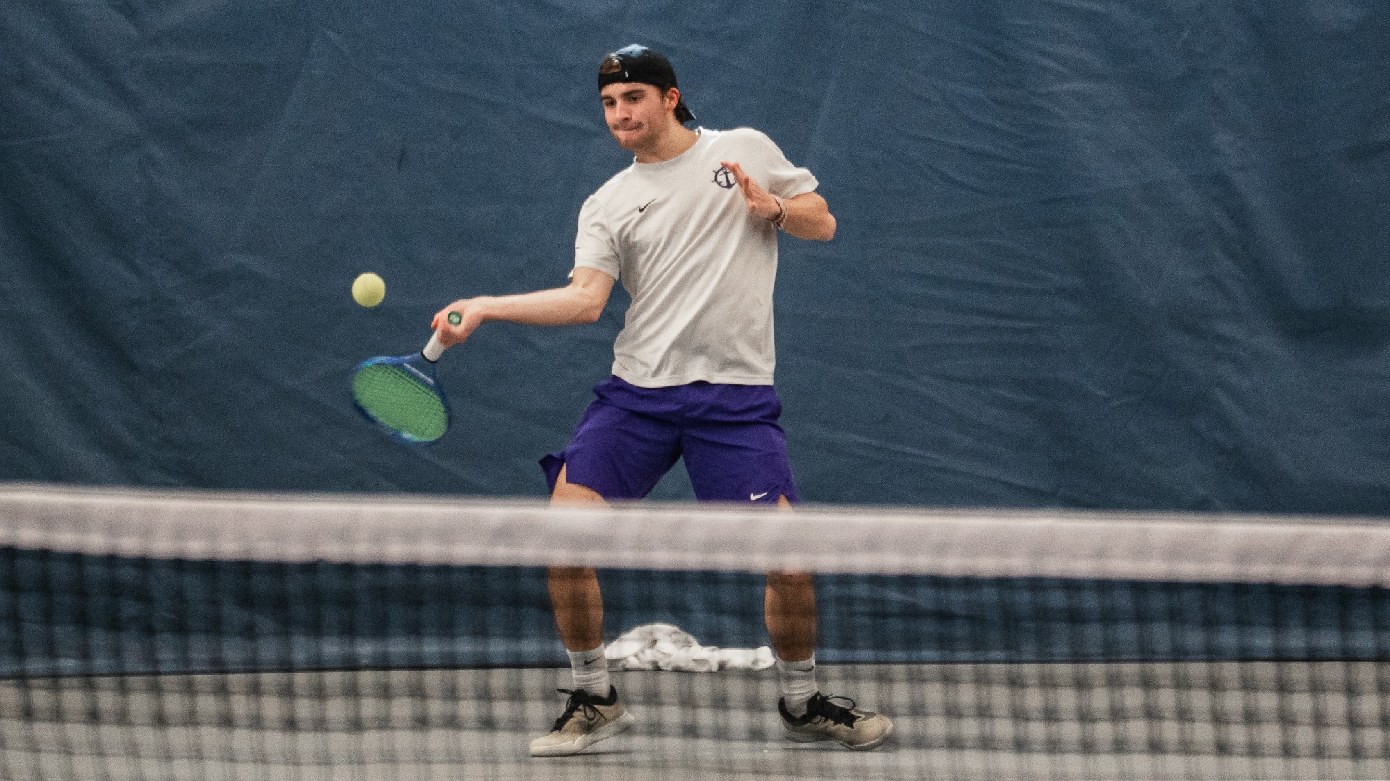 Tom Garcia hits a forehand in a home match versus Montana State.