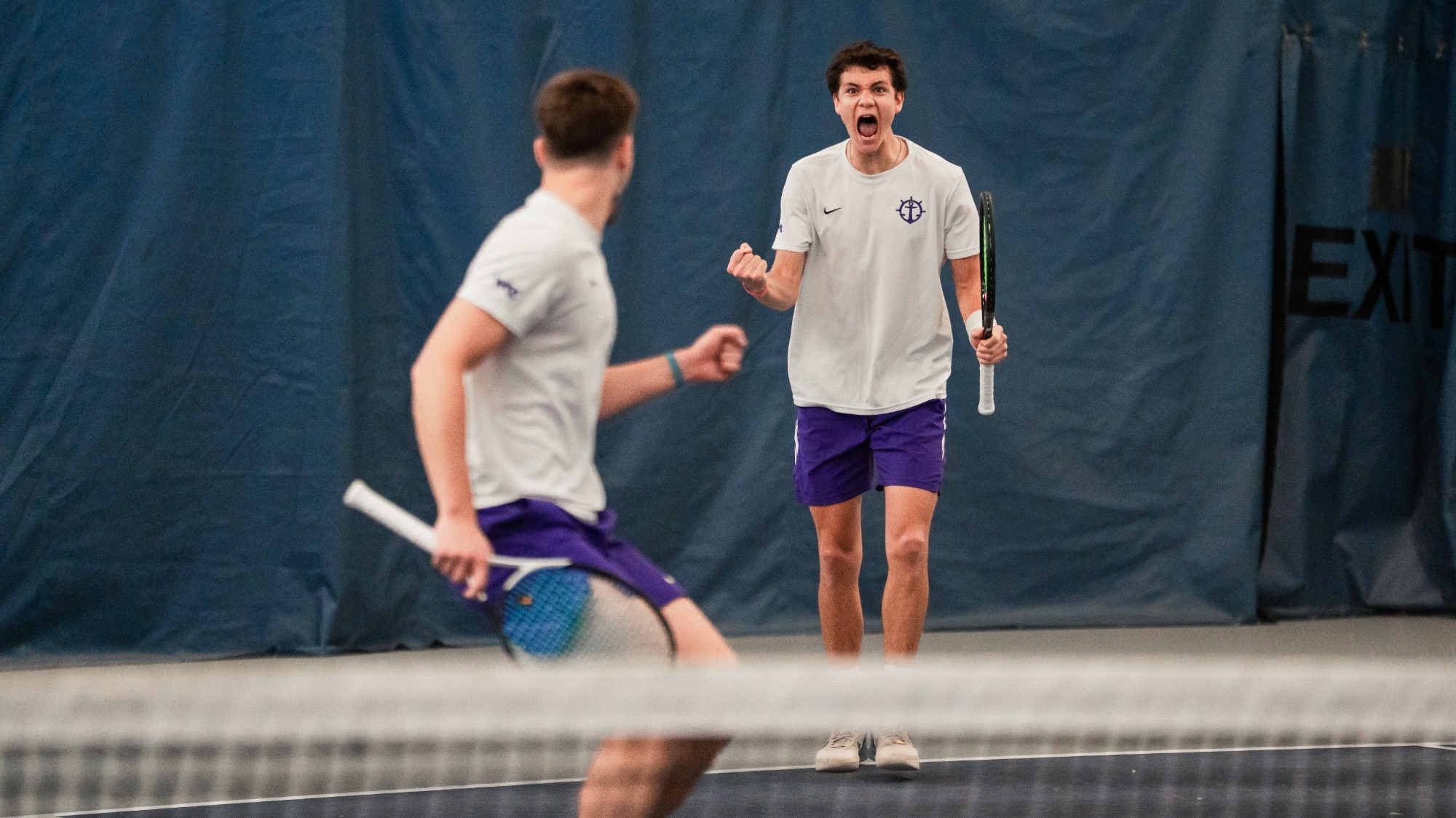 Cade Fernando and Nikola Keremedchiev celebrate winning a doubles point at home.
