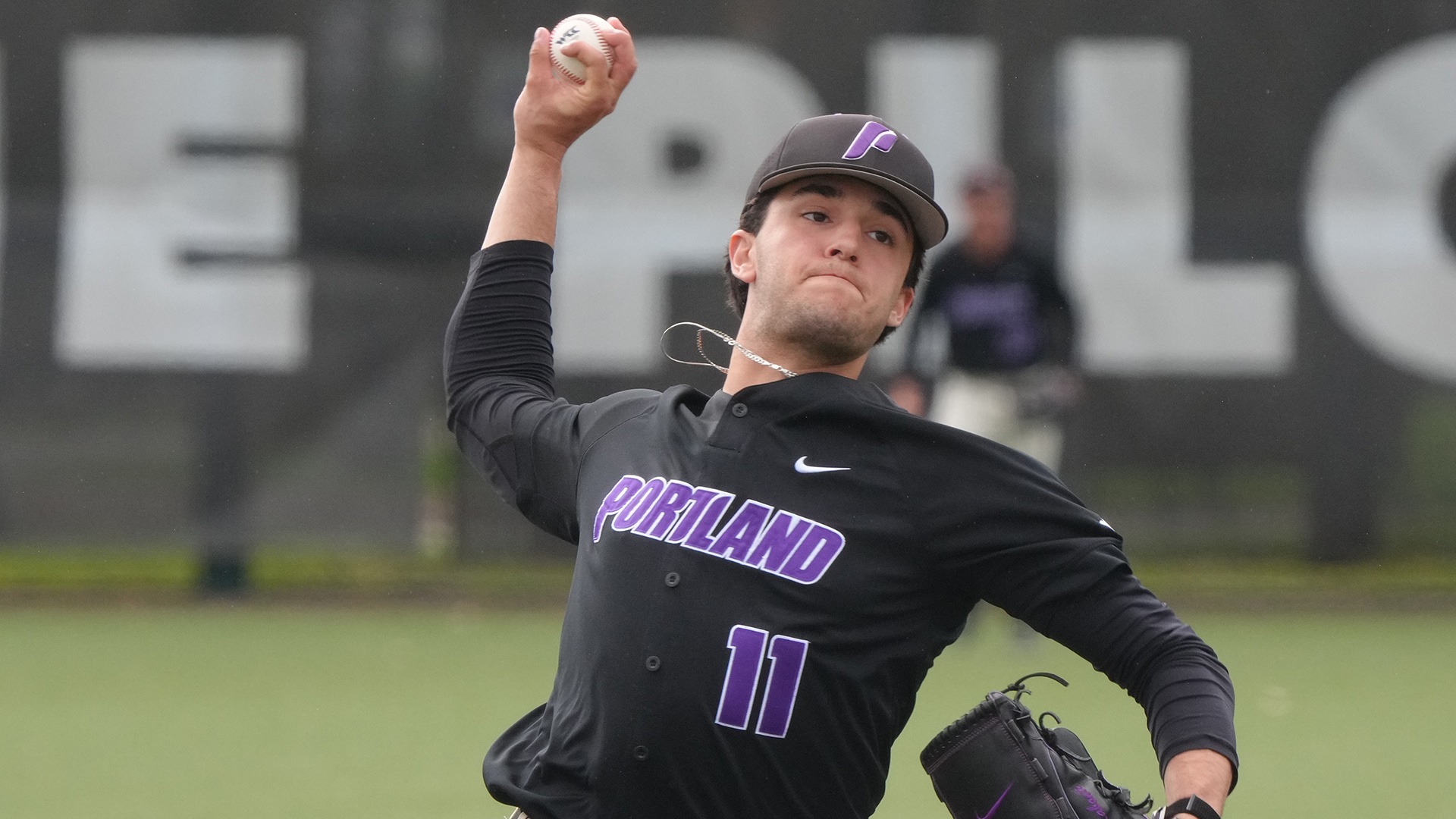 Will Labonte hurls a pitch against Holy Cross.