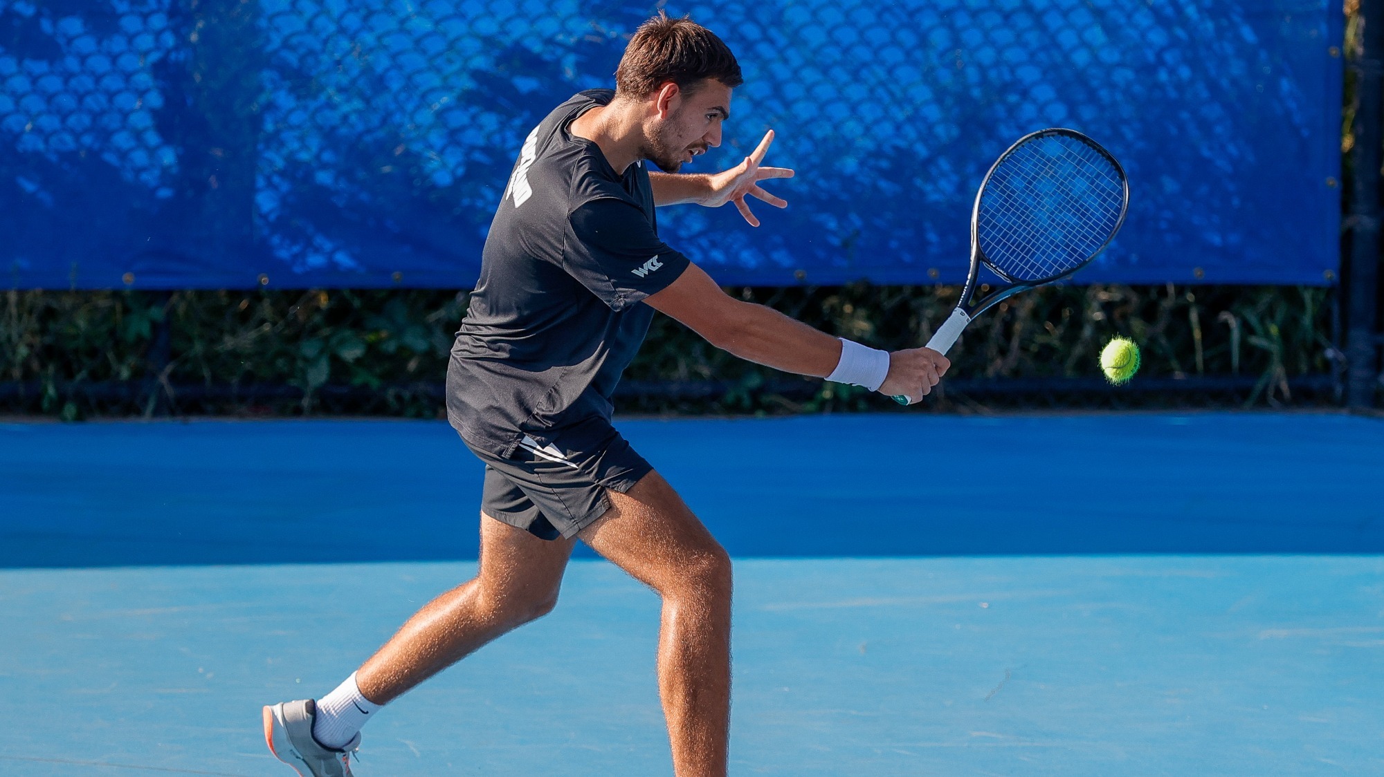 Stefan Skobelev hits a backhand.