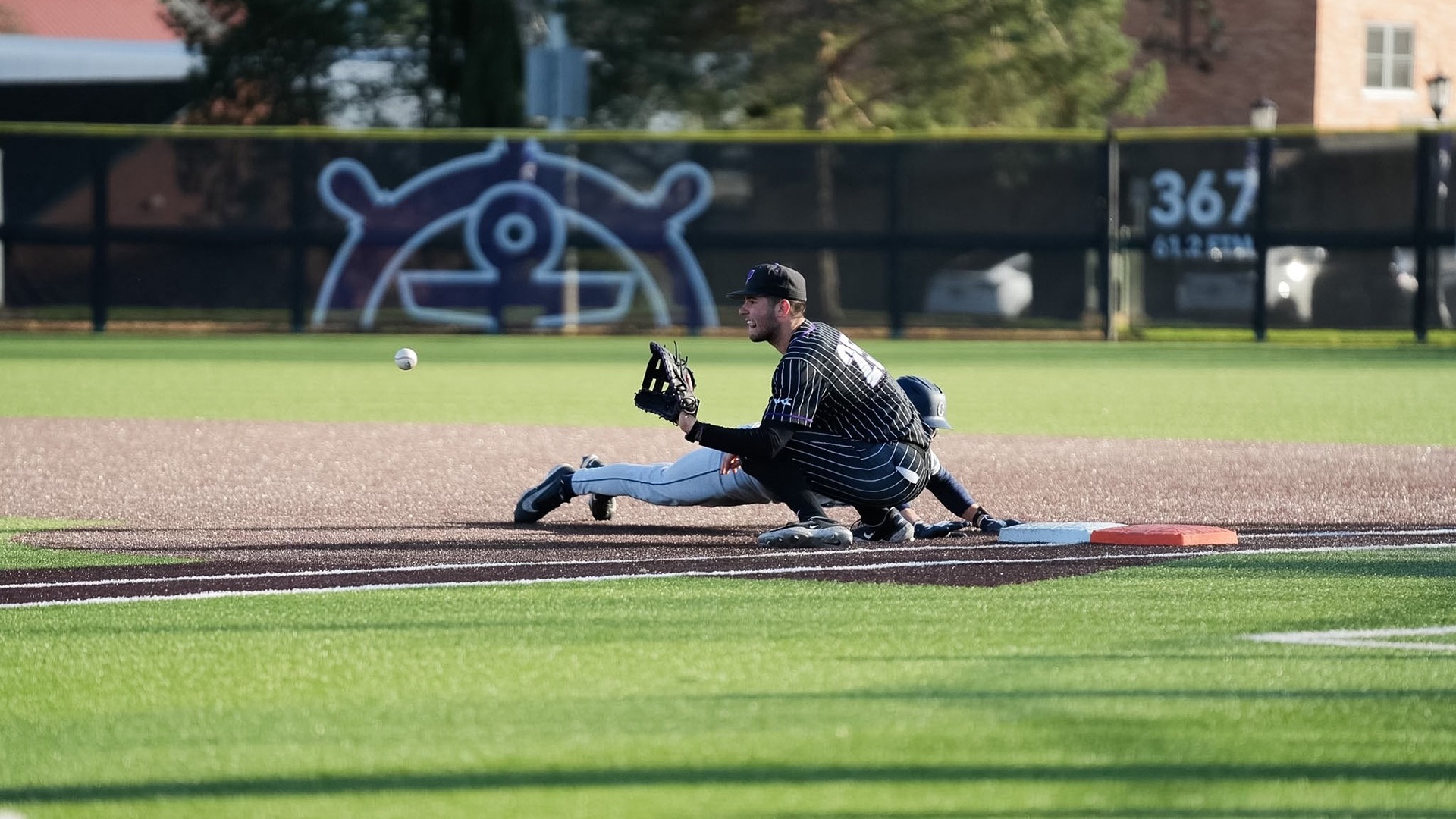 Leo Cote takes the ball at first base.