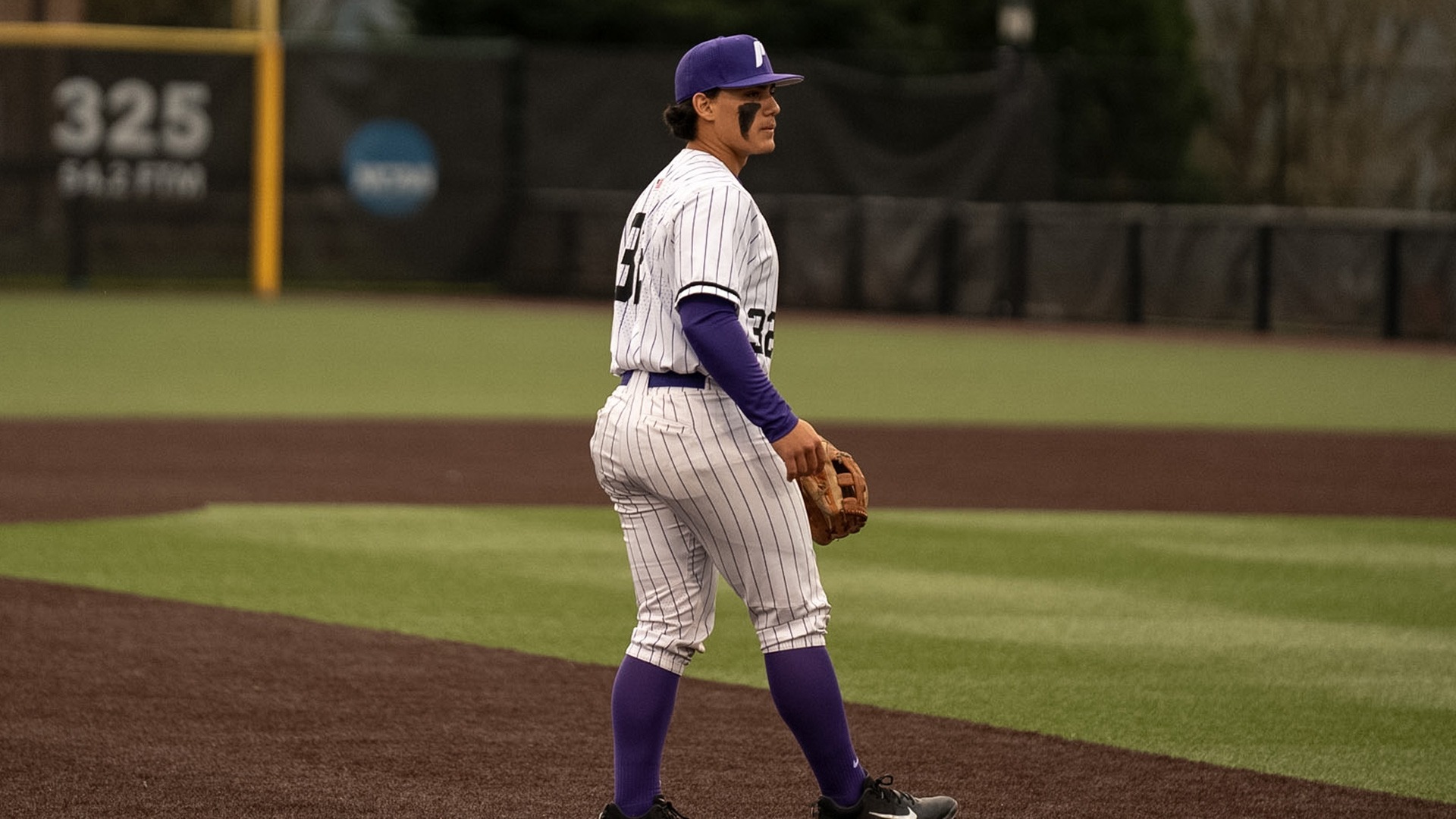 Dakota Chun awaits the play at third base.