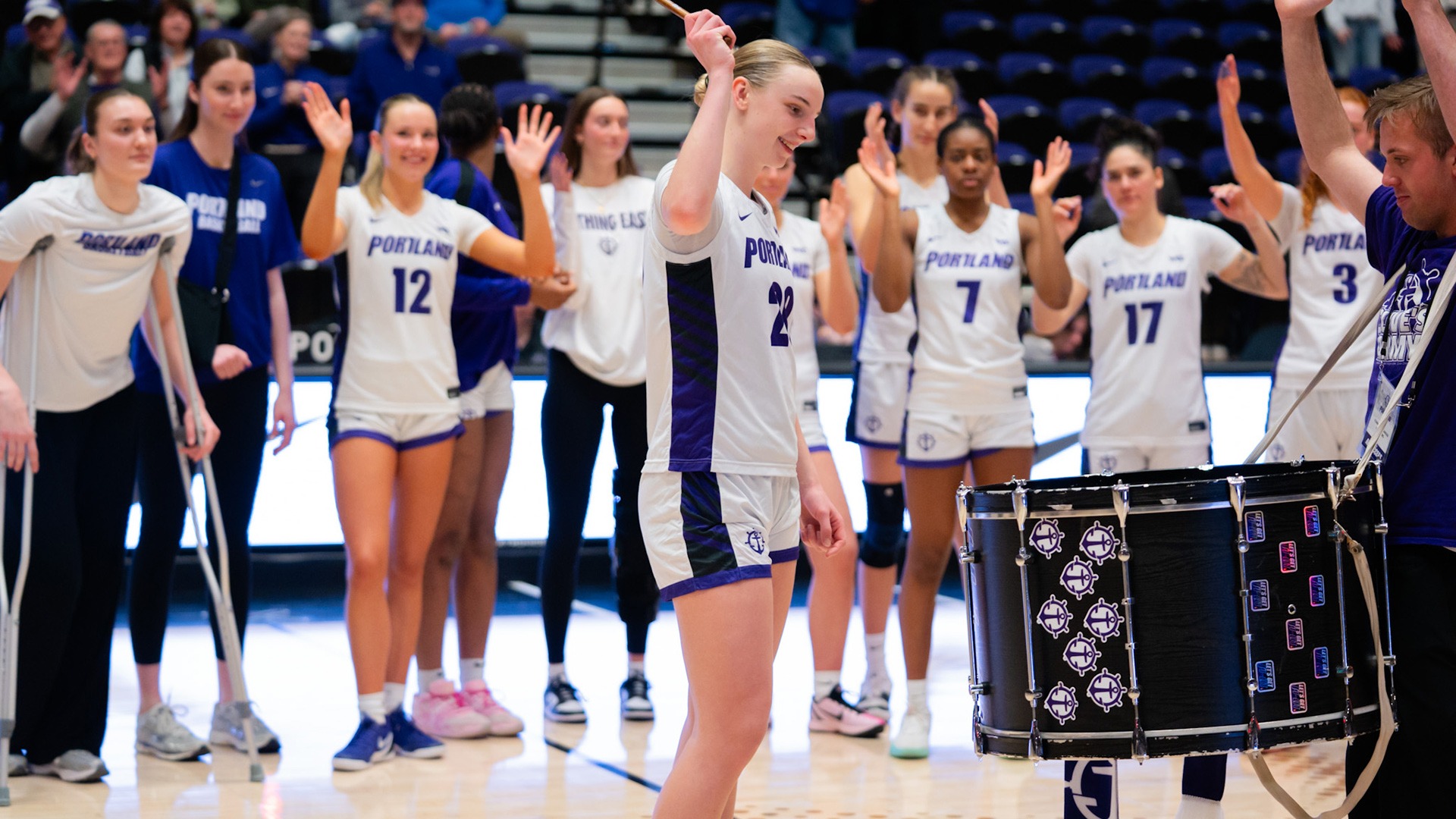 Lainey Spear bangs the drum after an opening round win over Sam Houston in the WNIT.