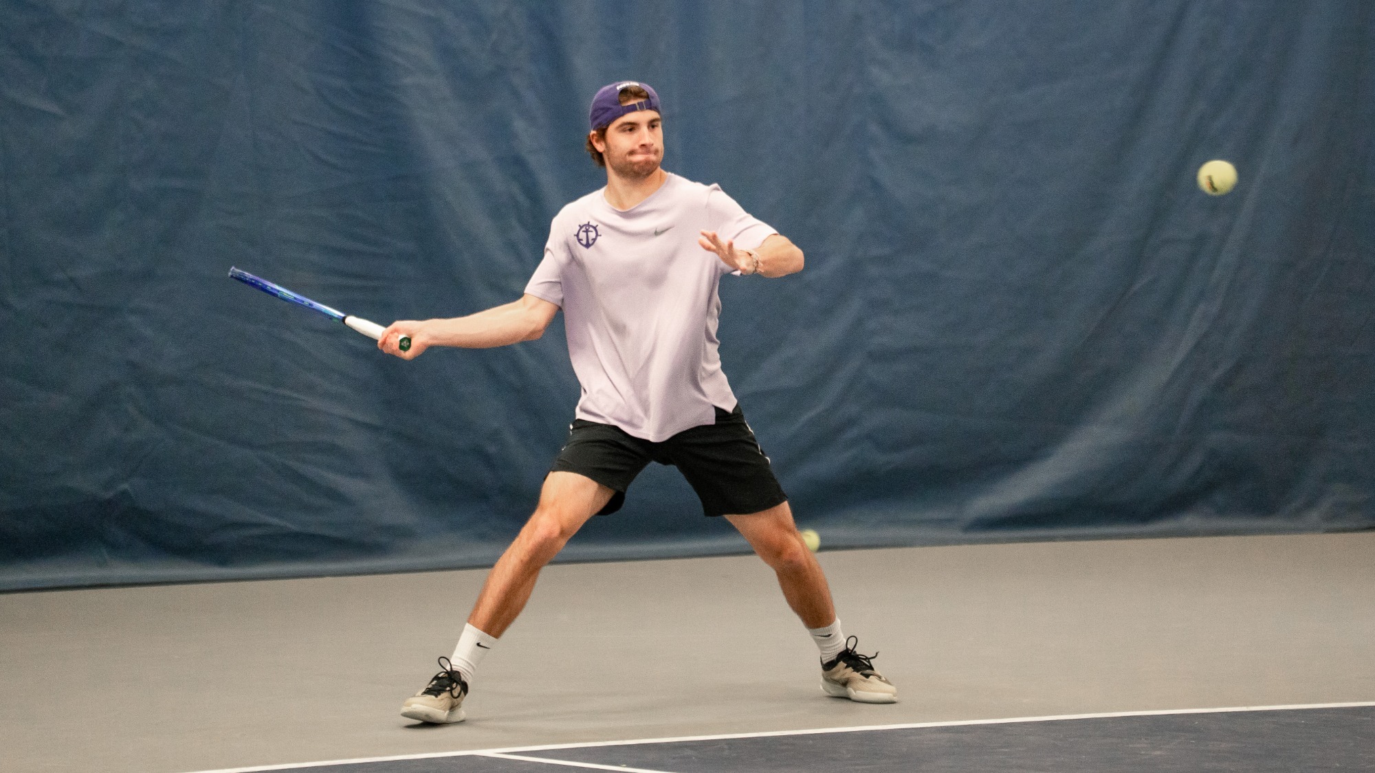 Tom Garcia hits a forehand during a home match against San Diego on March 27, 2026.