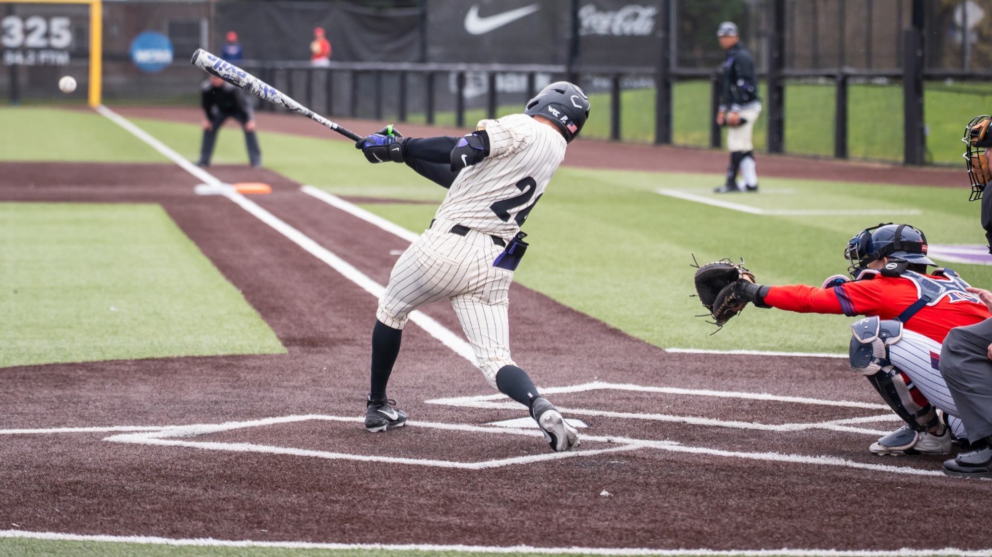 Gage Bruce rips a base hit in a home game against the Saint Mary's Gaels on March 29, 2026.
