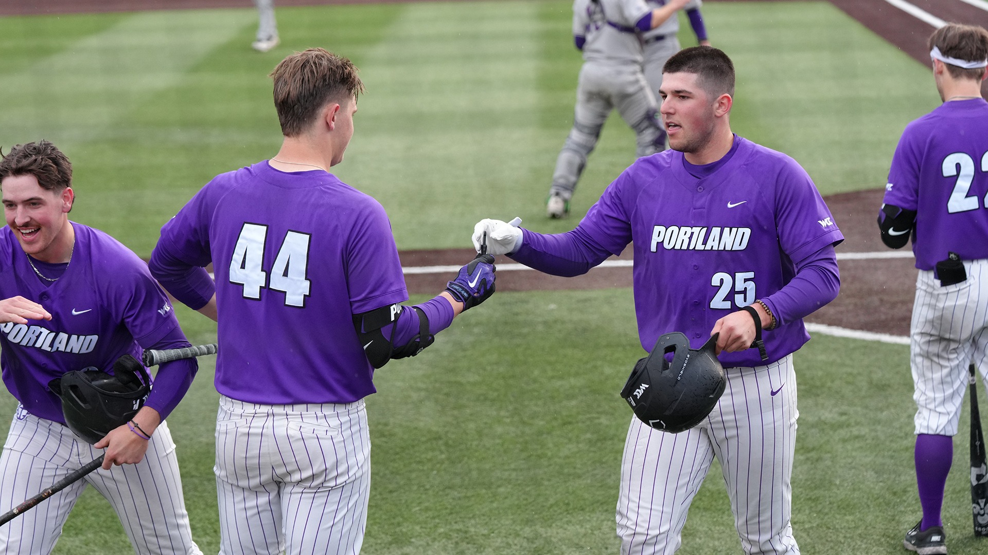 Leo Cote celebrates his home run against Holy Cross.