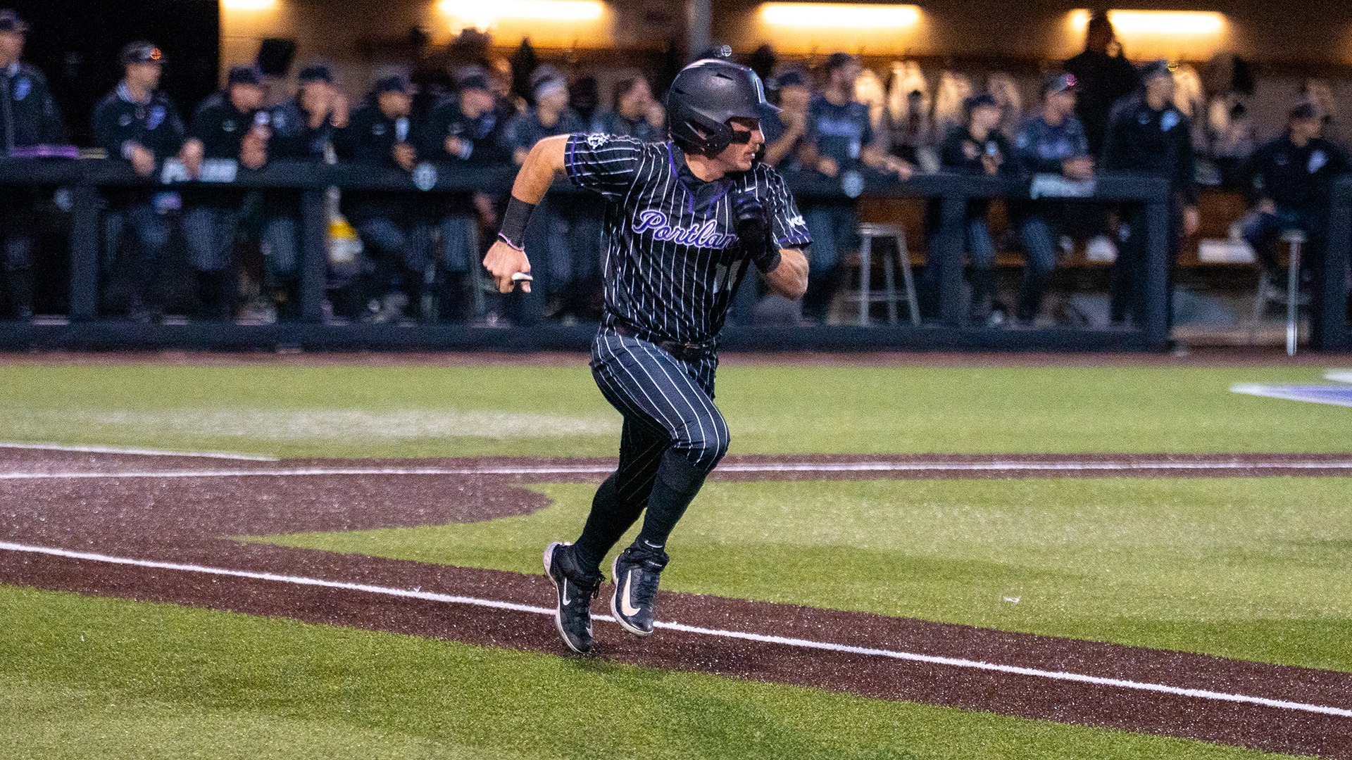 Jonas Salk sprints to first base.