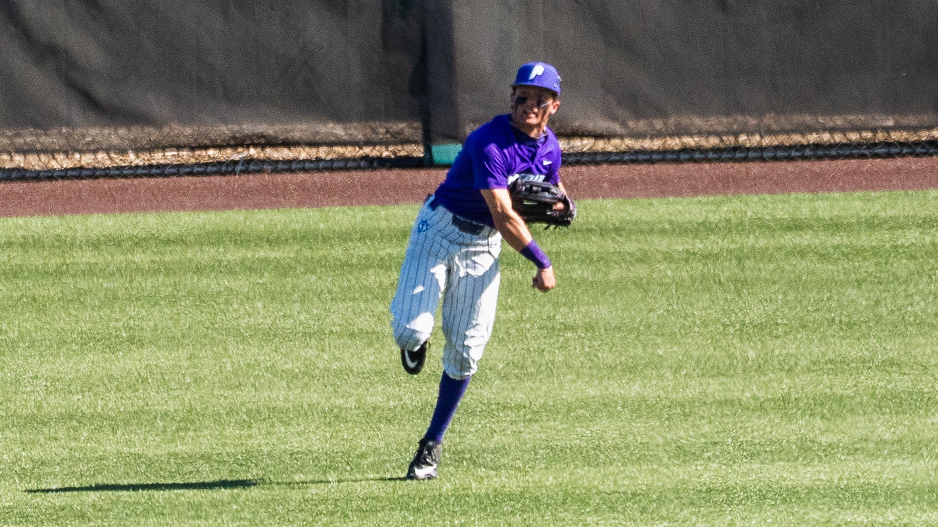 Cody Nitowitz throws a ball back home.