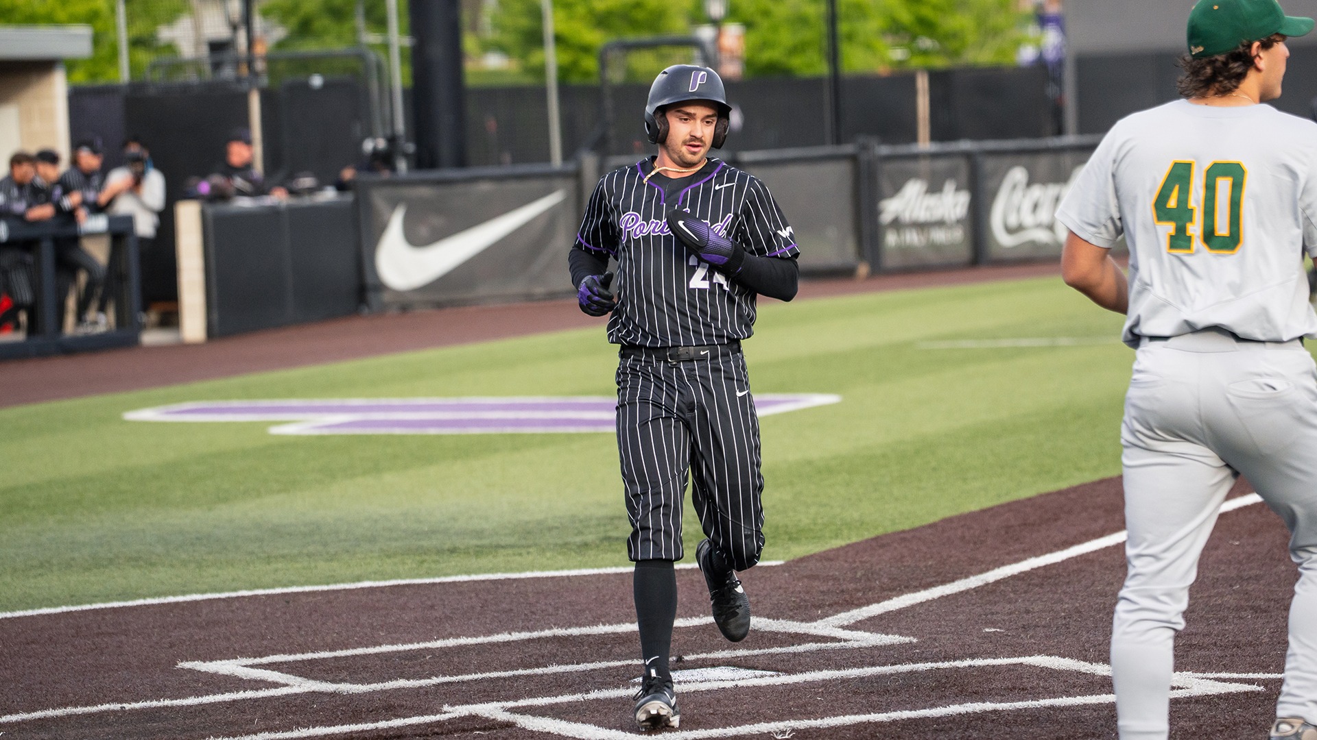 Gage Bruce crosses home plate for the Pilots.