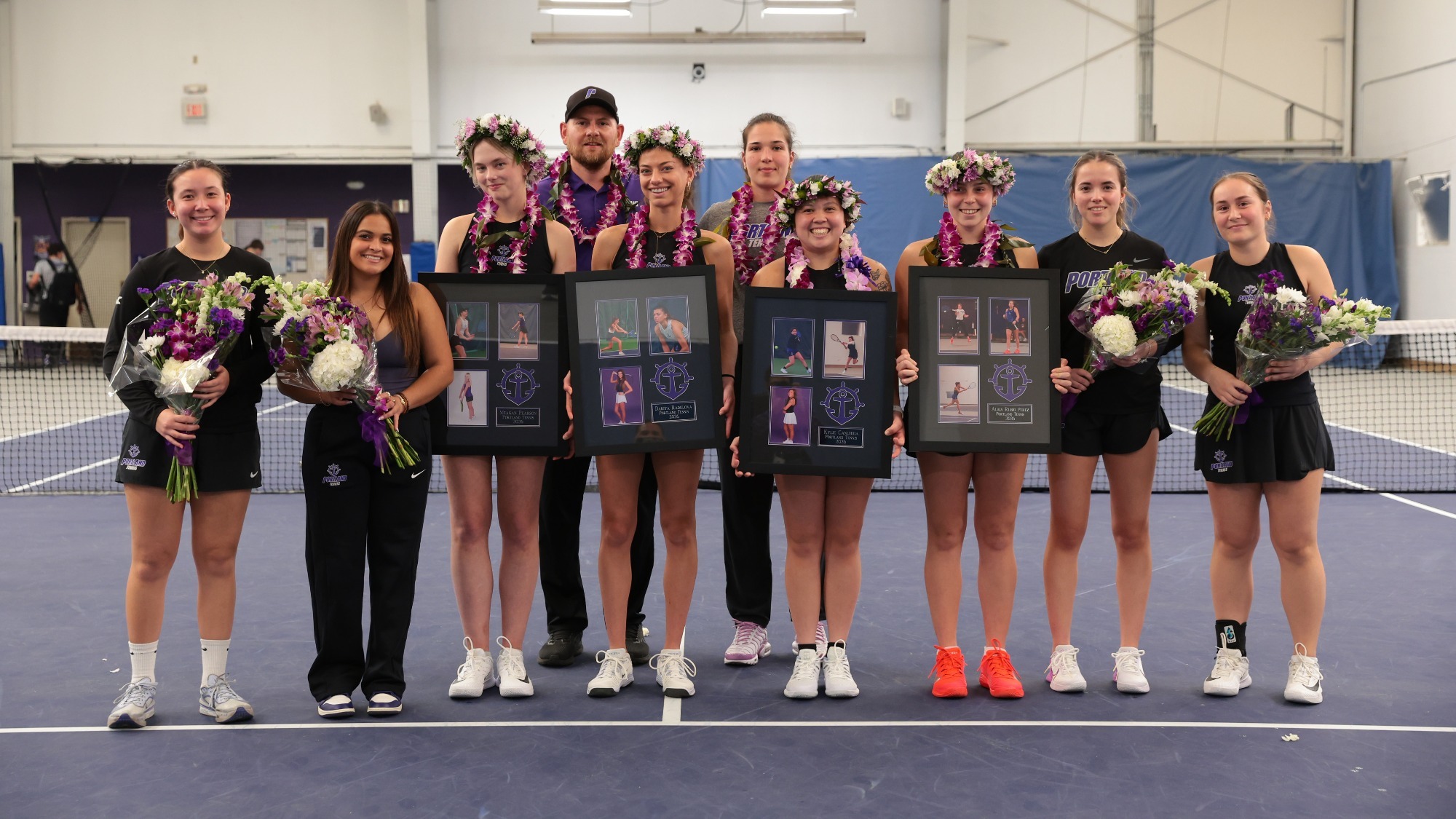 Portland women's tennis team poses after a senior day pre-match ceremony.