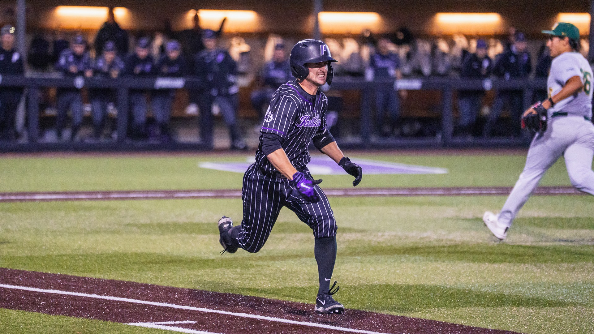 Brady Bean runs to first base.