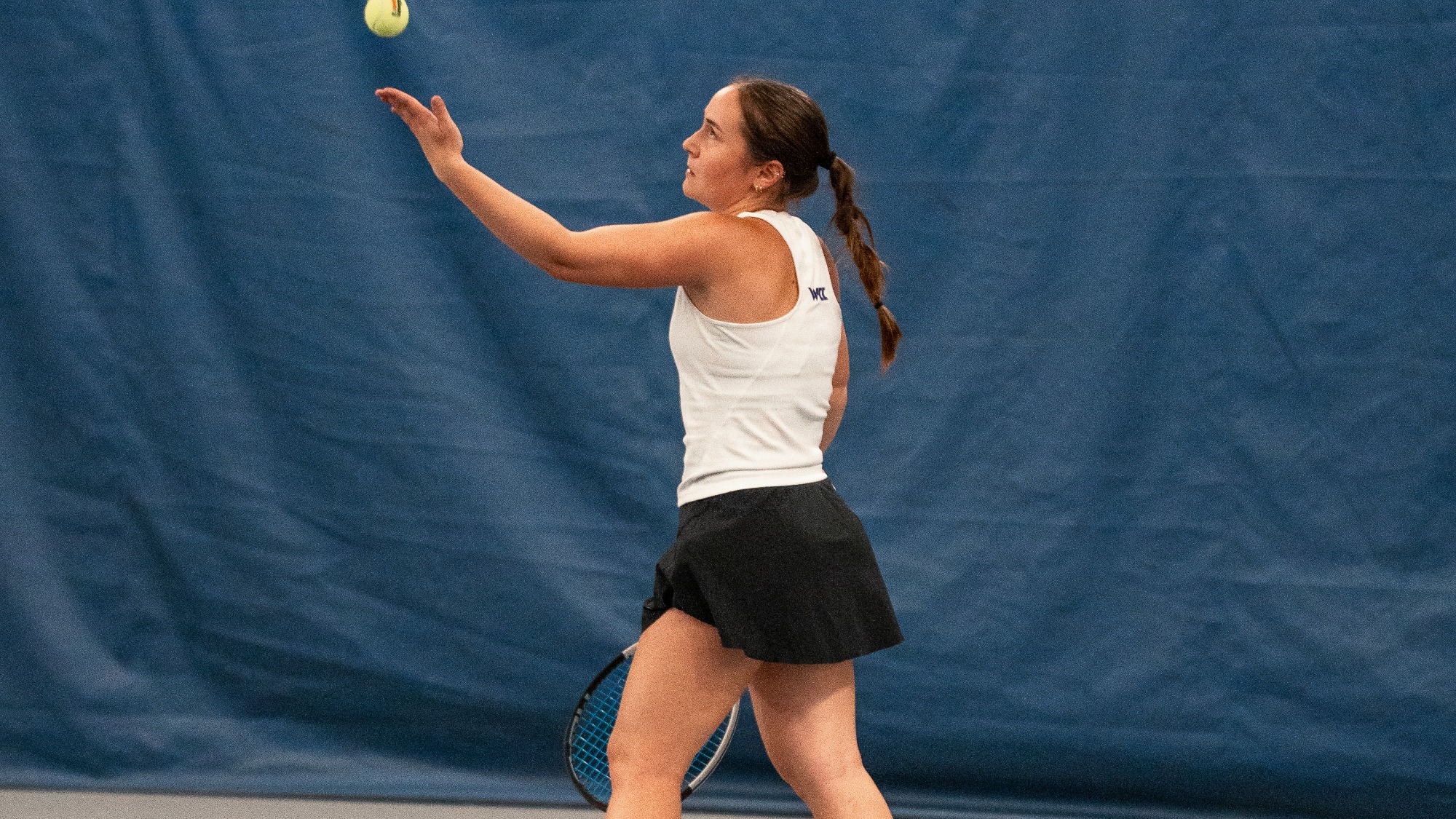 Maria Galatescu tosses for a serve during a home match at LPTC.