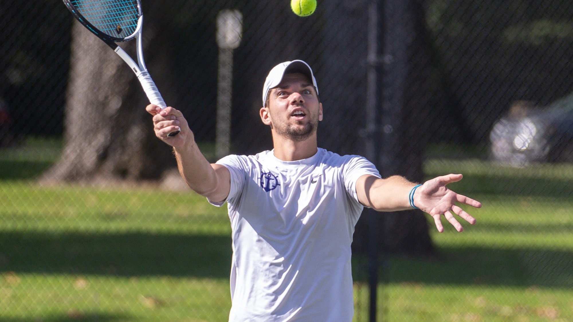 Nikola Keremedchiev hits a volley at the net during a match.