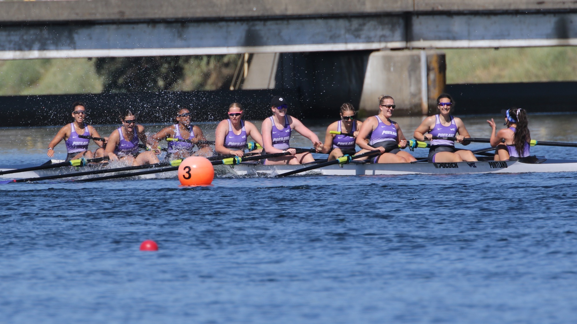 Portland rowing's second varsity eight celebrates after placing third in heat 2 and qualifying for the grand final at Friday's WCC Championships.