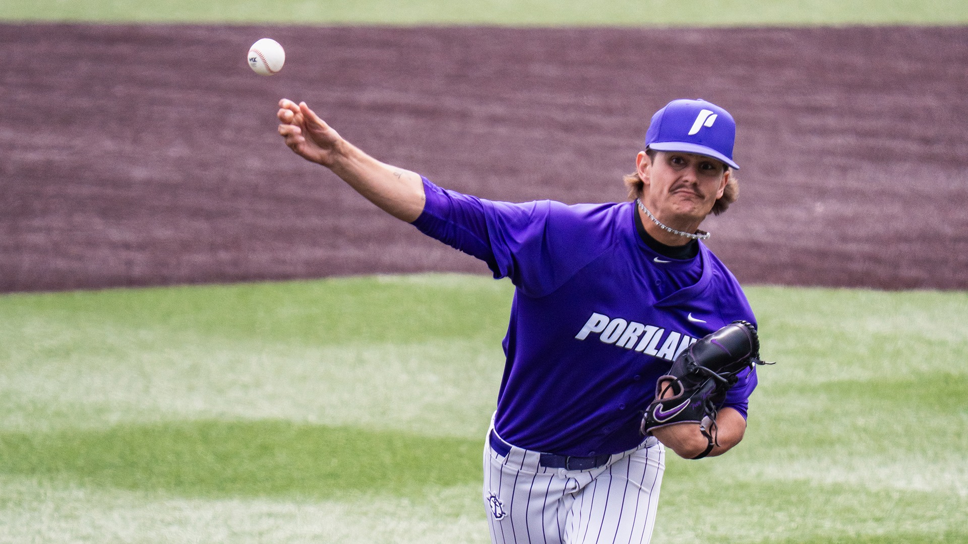 Trey Newmann throws the pitch with force against San Diego.
