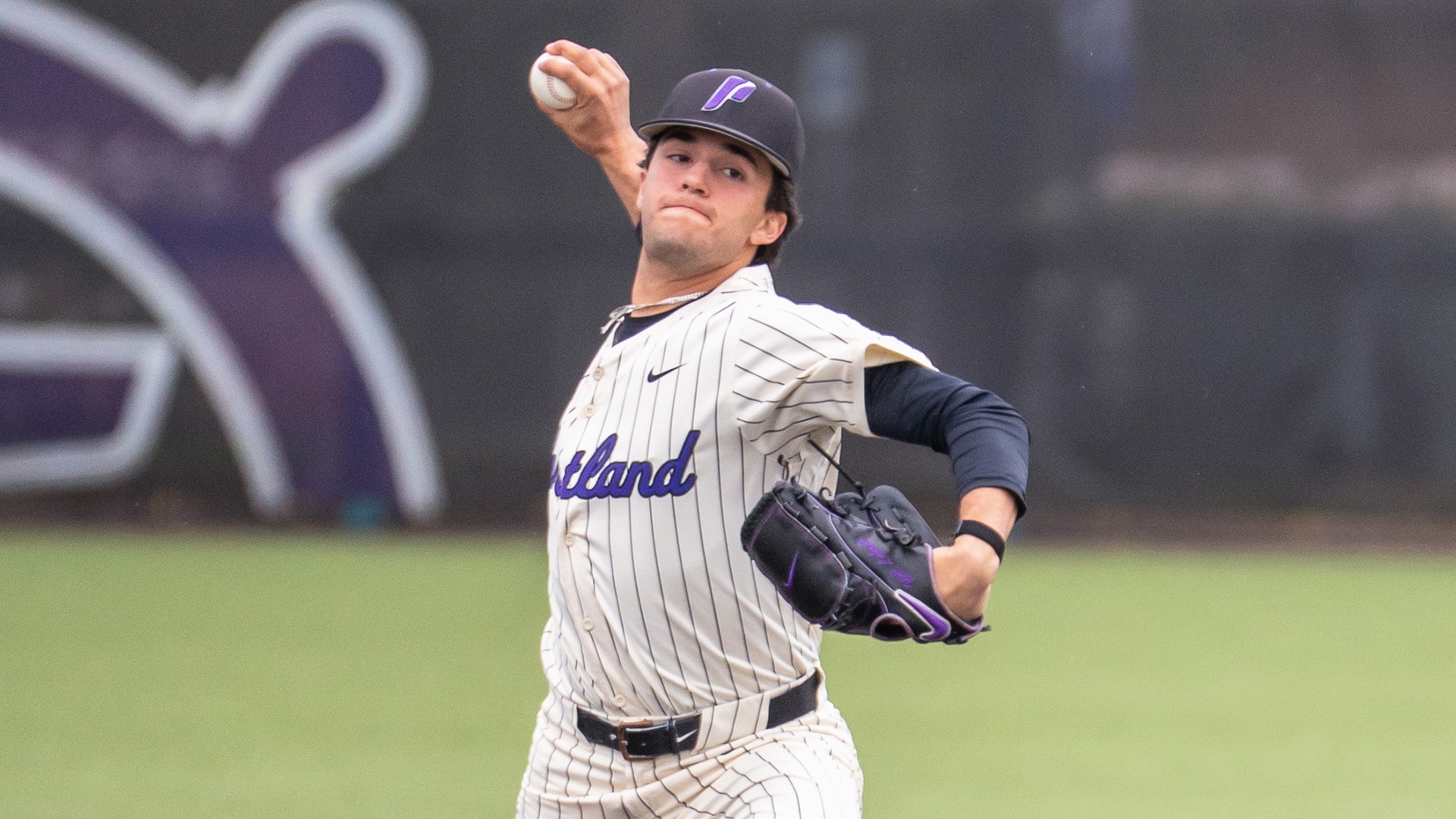Will Labonte at the high point of his delivery throwing a pitch.