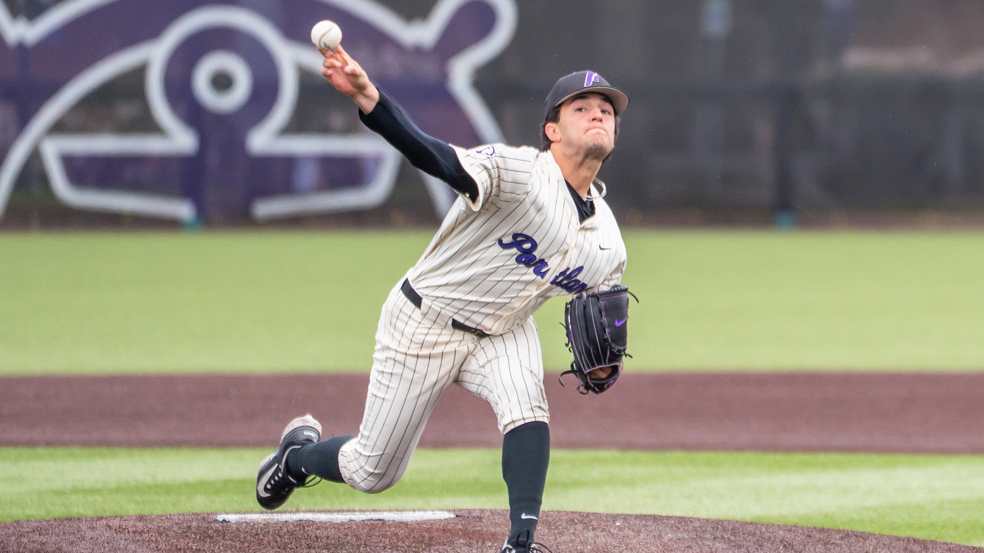 Will Labonte throws a pitch against Saint Mary's.