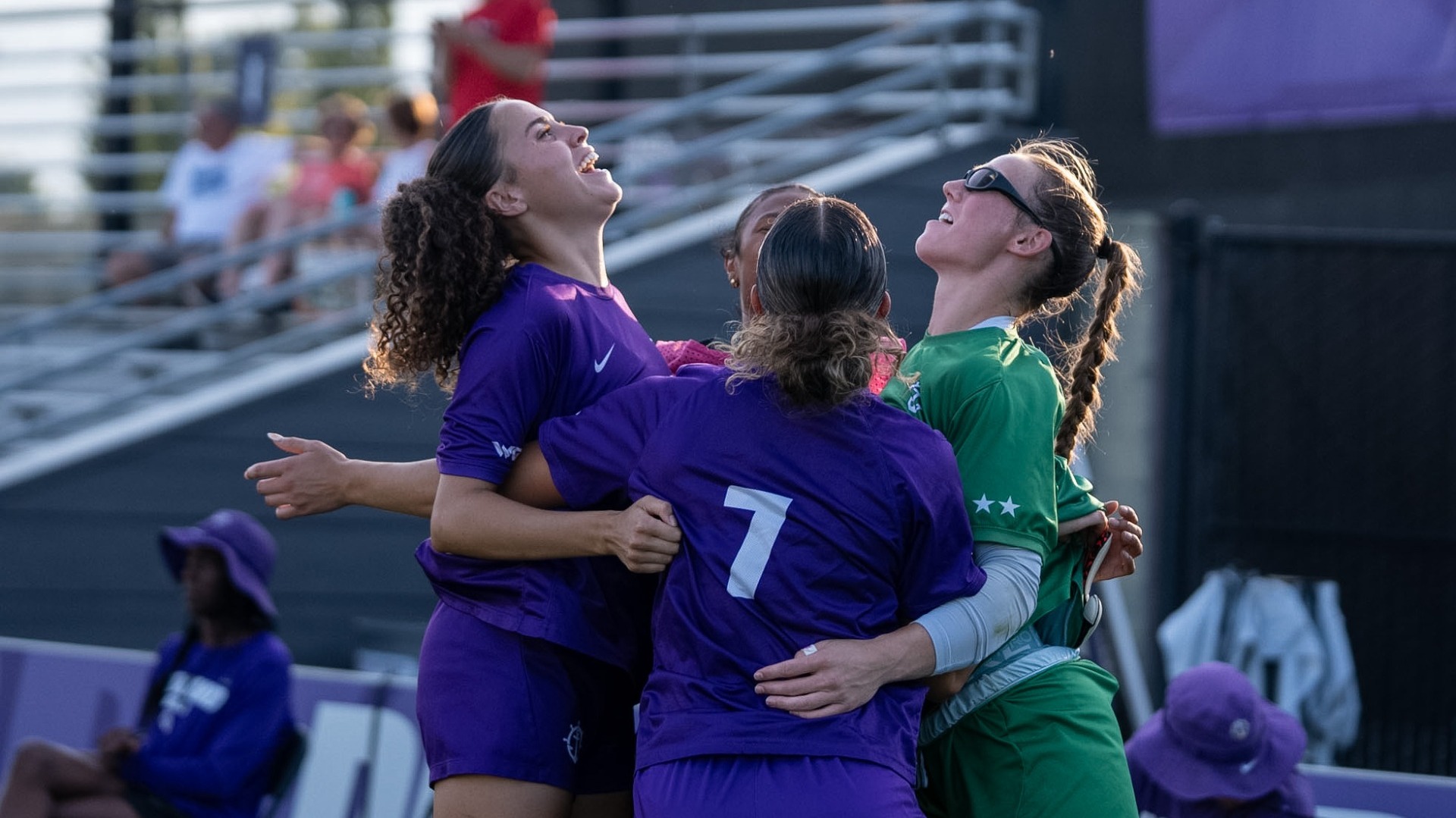 The Pilots celebrate a goal from their purple-white scrimmage.