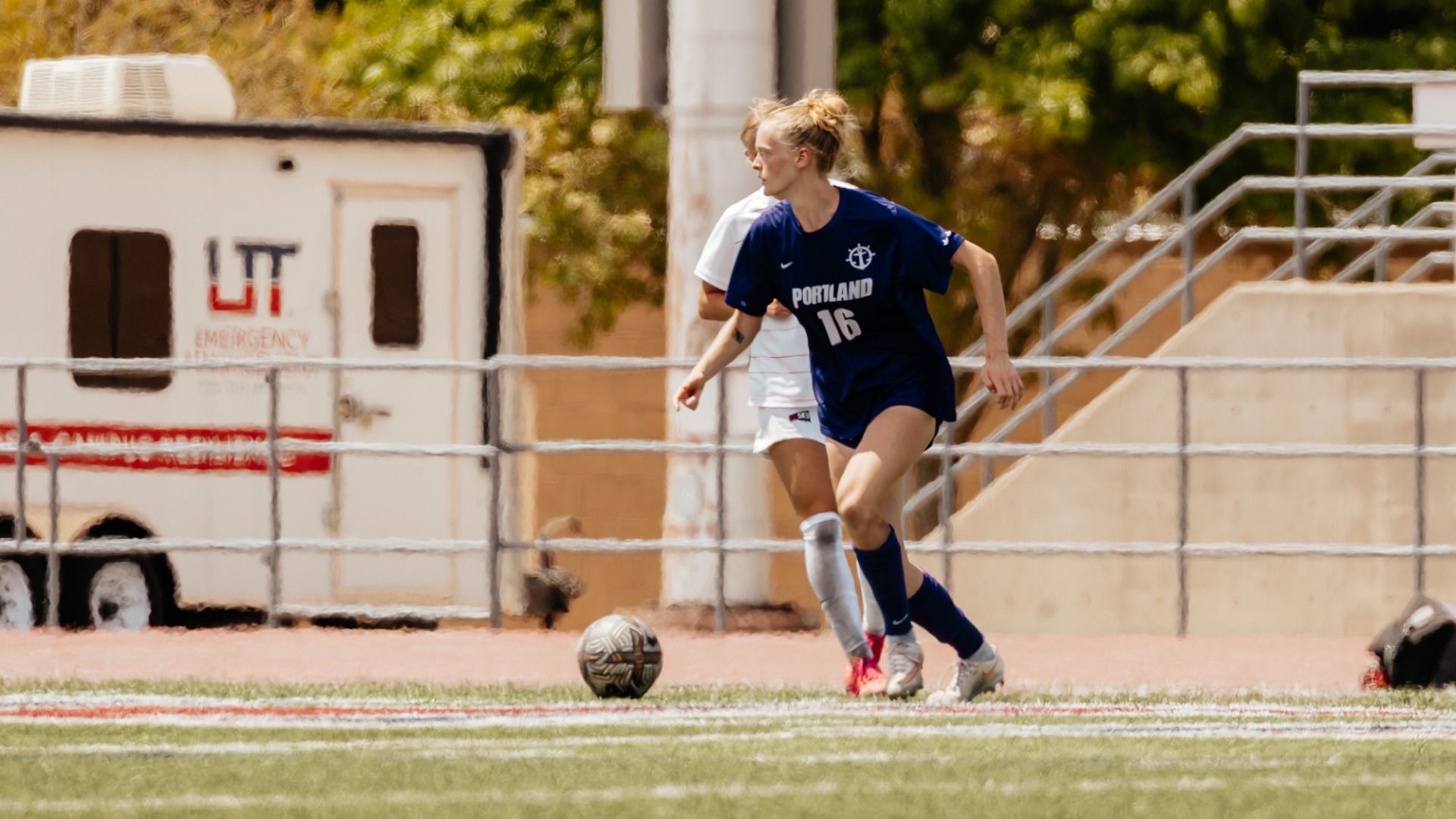 Ruby Settle navigates the midfield and looks for an open pass.