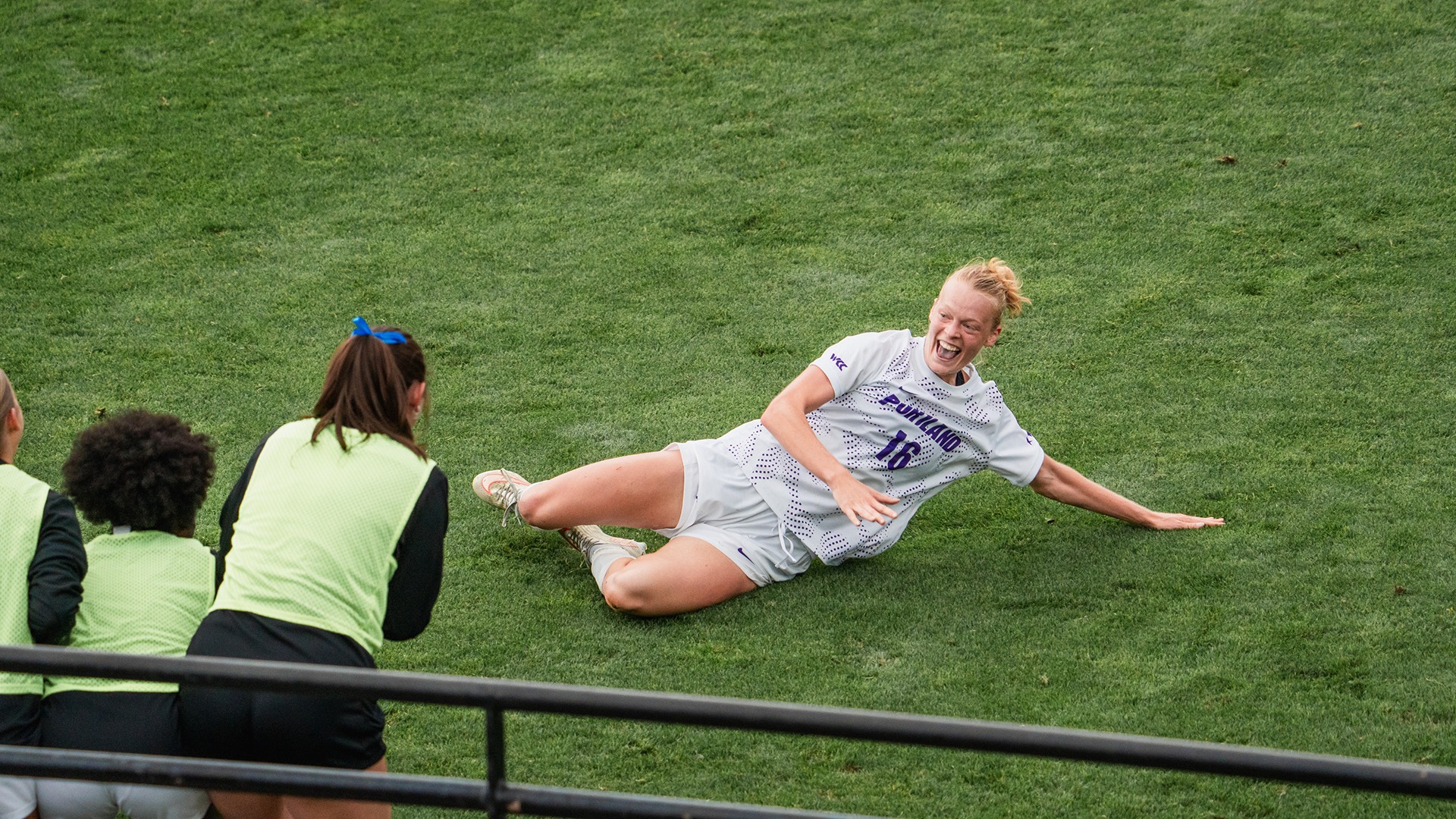 Ruby Settle slides to celebrate her goal against Oregon State.