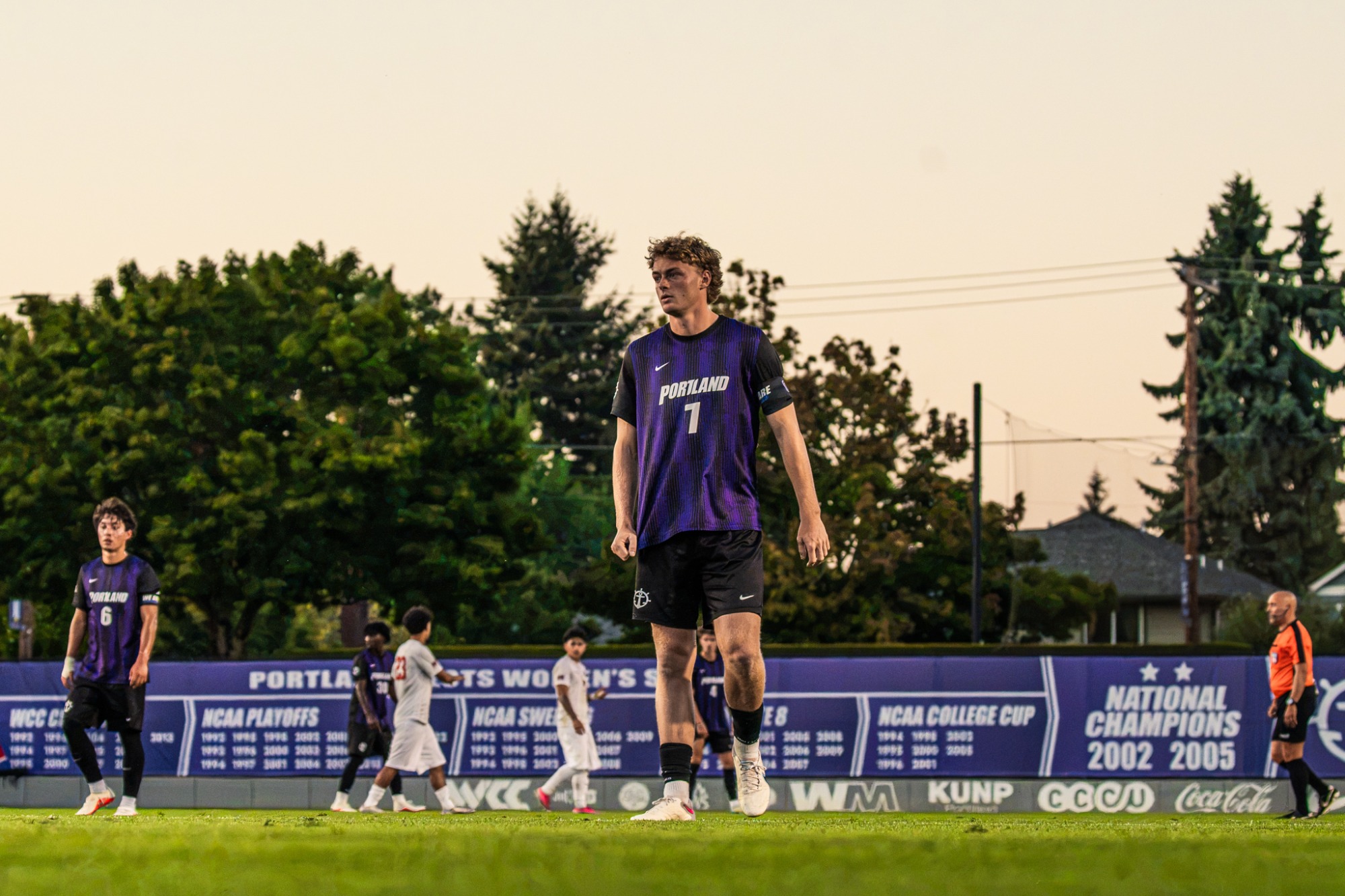 Joe Highfield walks the field against Southern Oregon.
