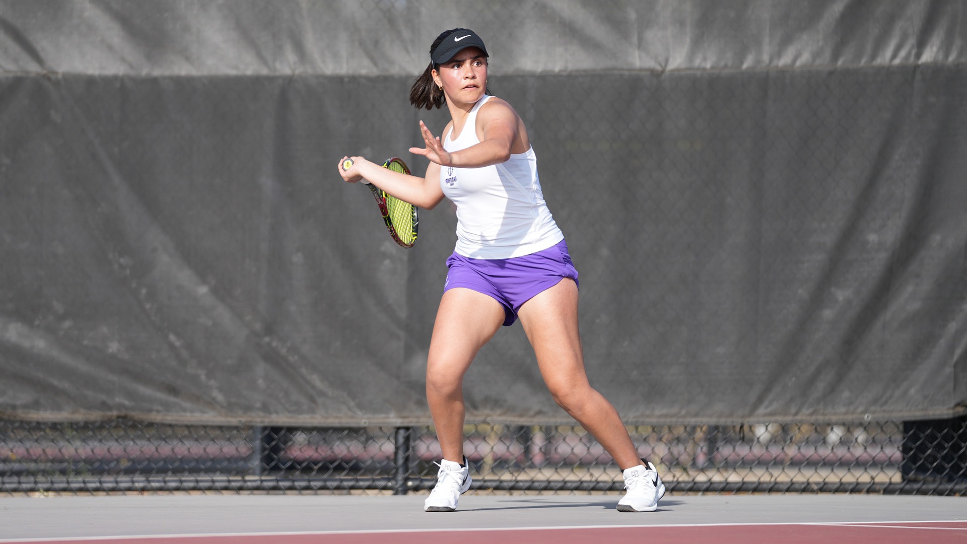 Emily Velasco hits a forehand during a match at the WSU Cougar Classic