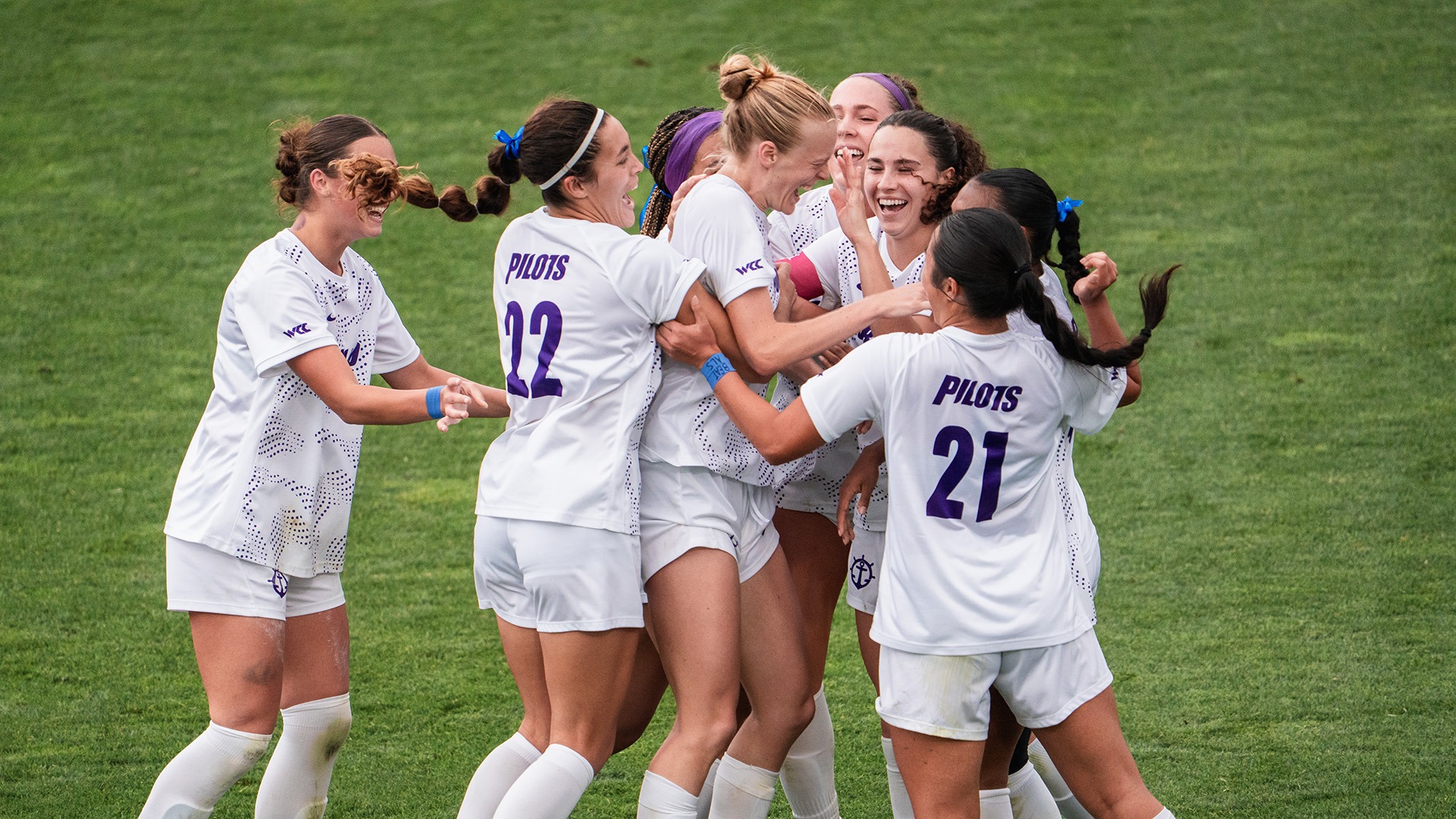 Ruby Settle is swarmed by her teammates after her goal against OSU.