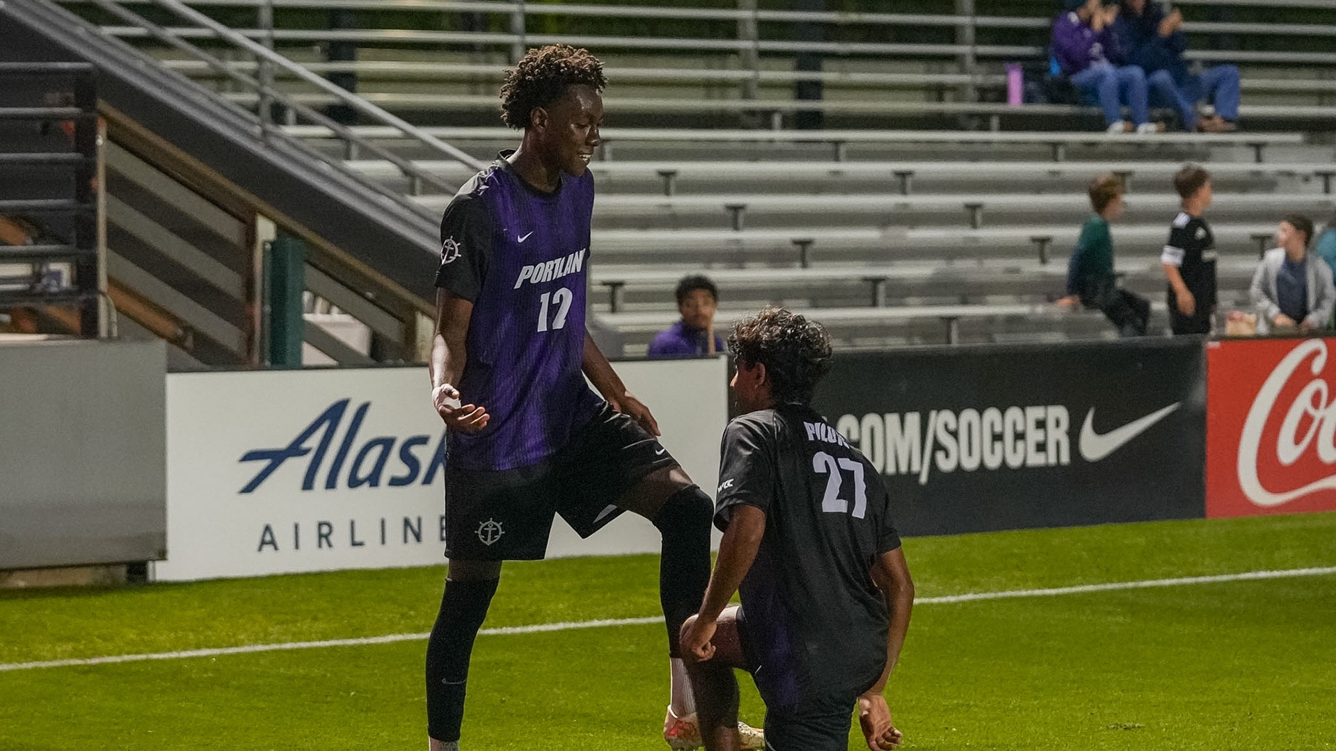 Isaac Emojong and Ritvik Karra celebrate Emojong's goal.