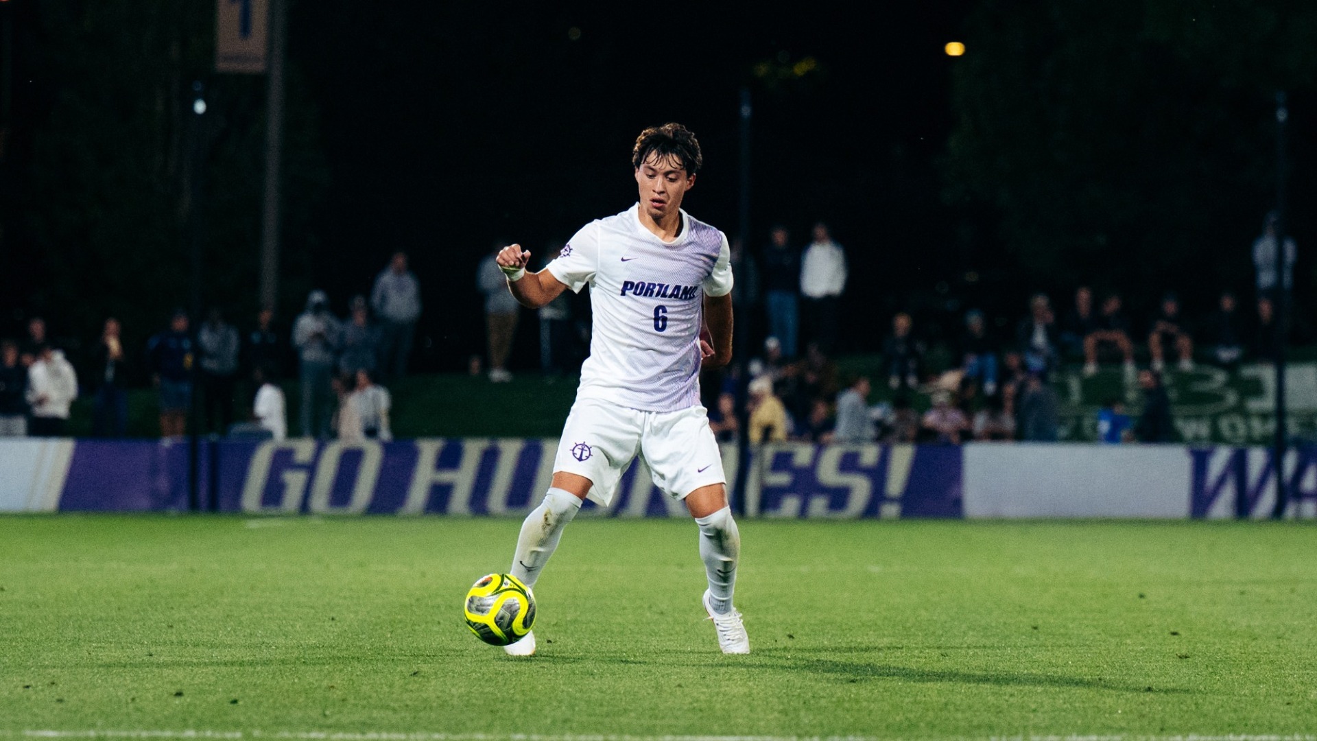 Christian Mendoza works the midfield against Washington.
