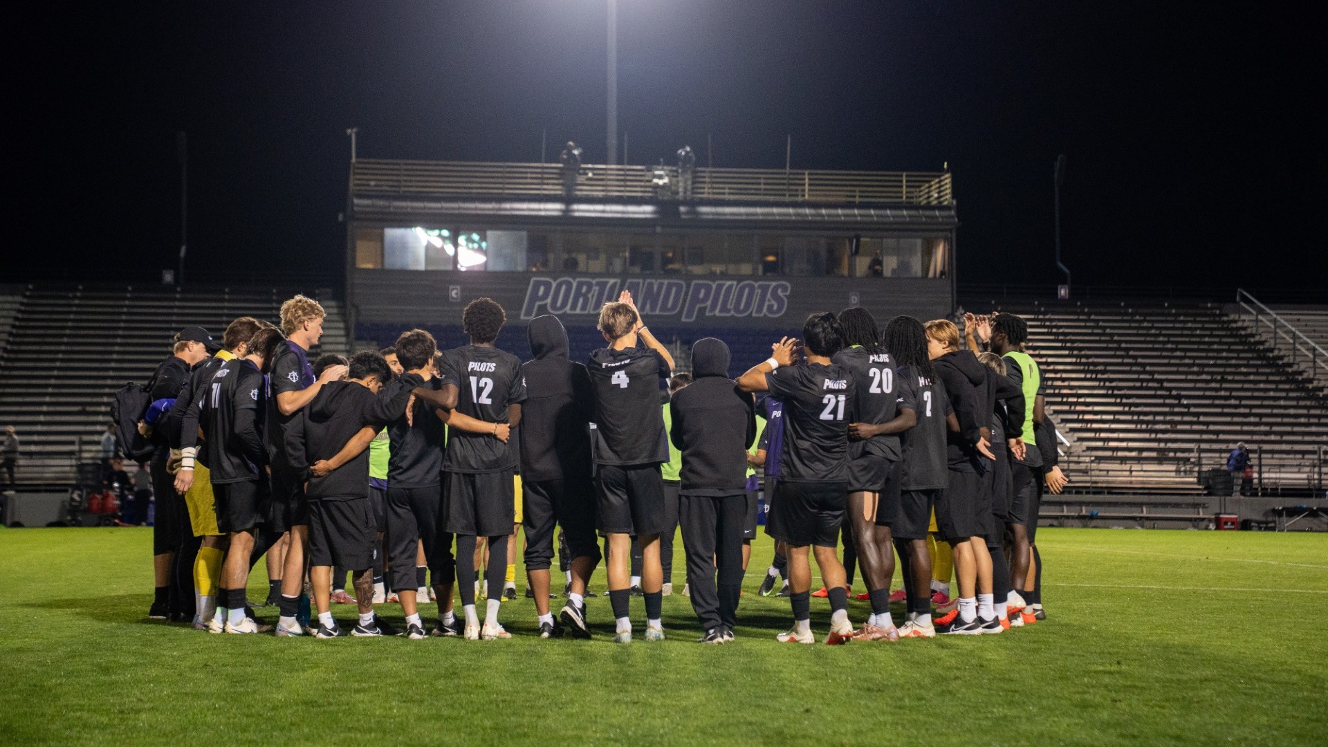 The Pilots huddle up after their loss to Wisconsin.