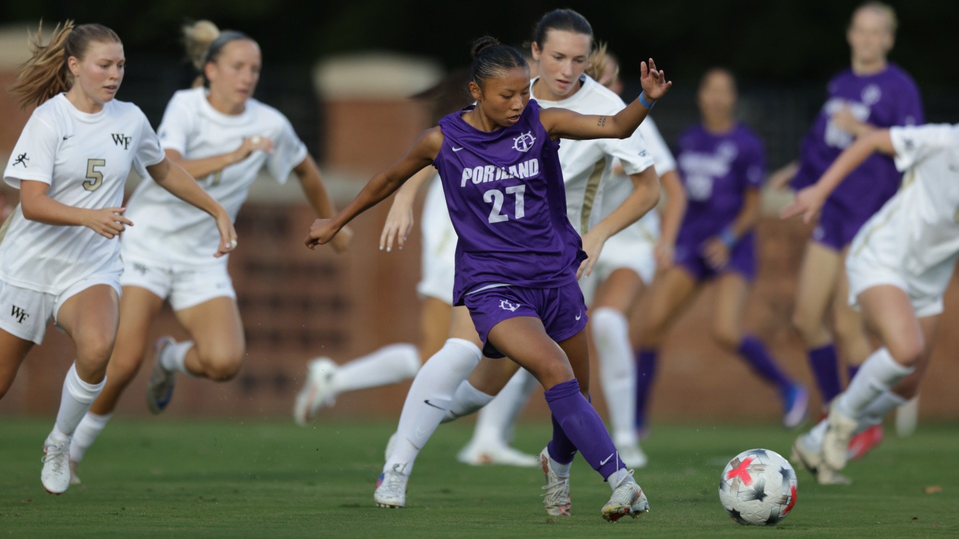 Kyah Zurek navigates the swarm of Wake Forest defenders.
