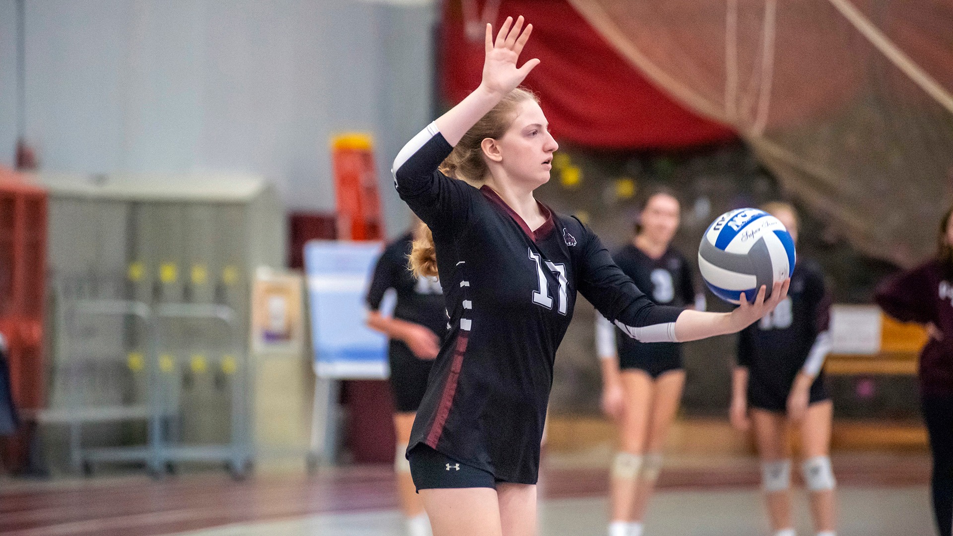Emily Prest serves against Oswego on 10/7/23.