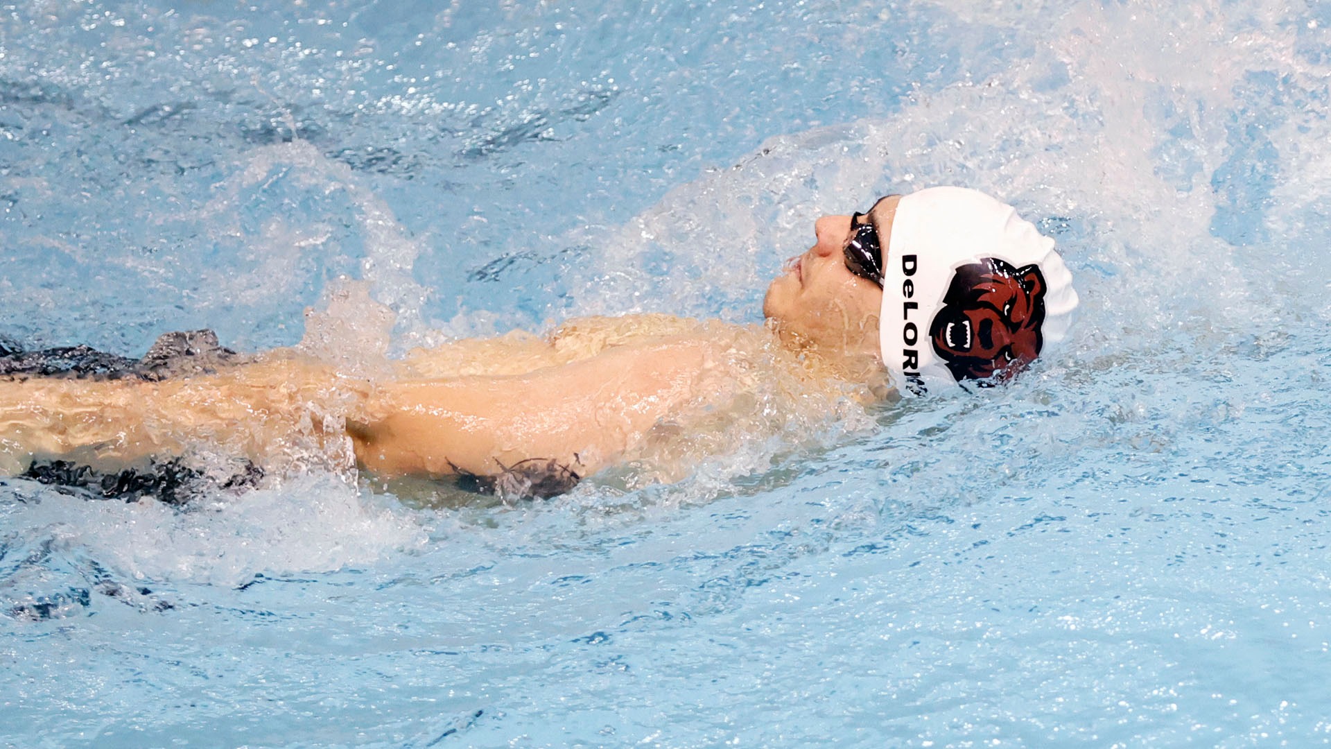 Zach DeLorme swims during the North Country Invitational on 11/21/25.