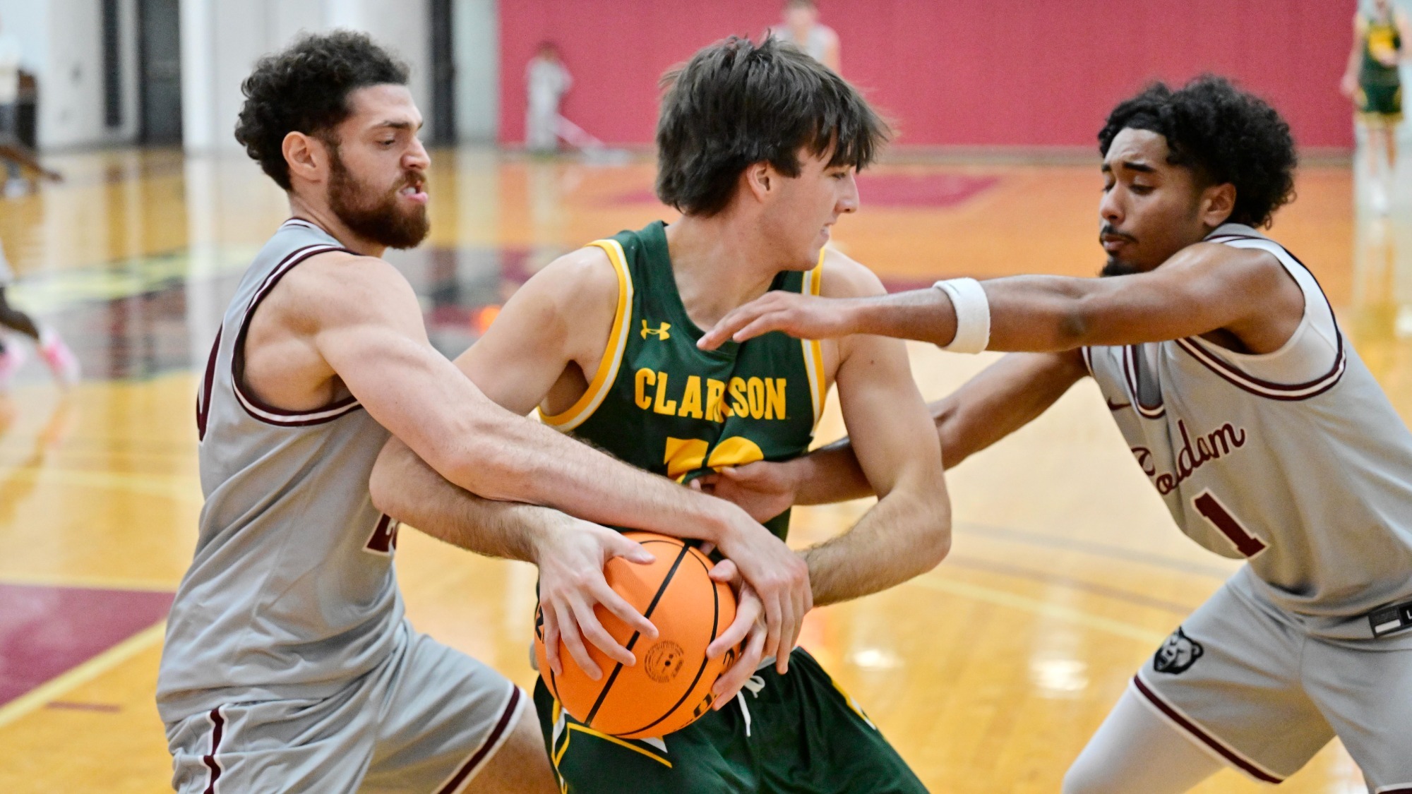 Yoav Cohen and Ethan Baksh fight for a ball against Clarkson on 11/25/25.