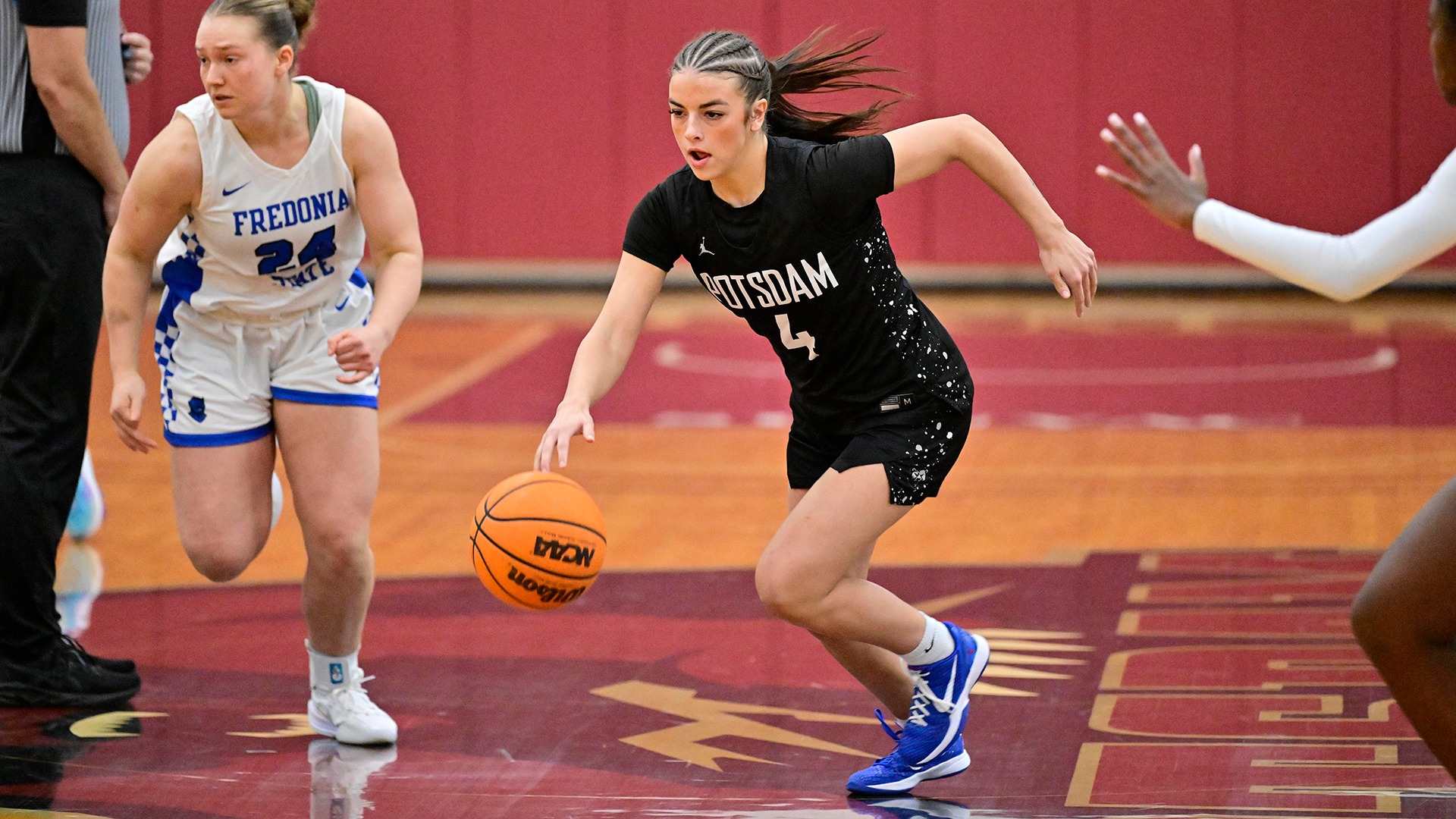 Lucie Scarpine races up the court against Fredonia on 12/6/25.