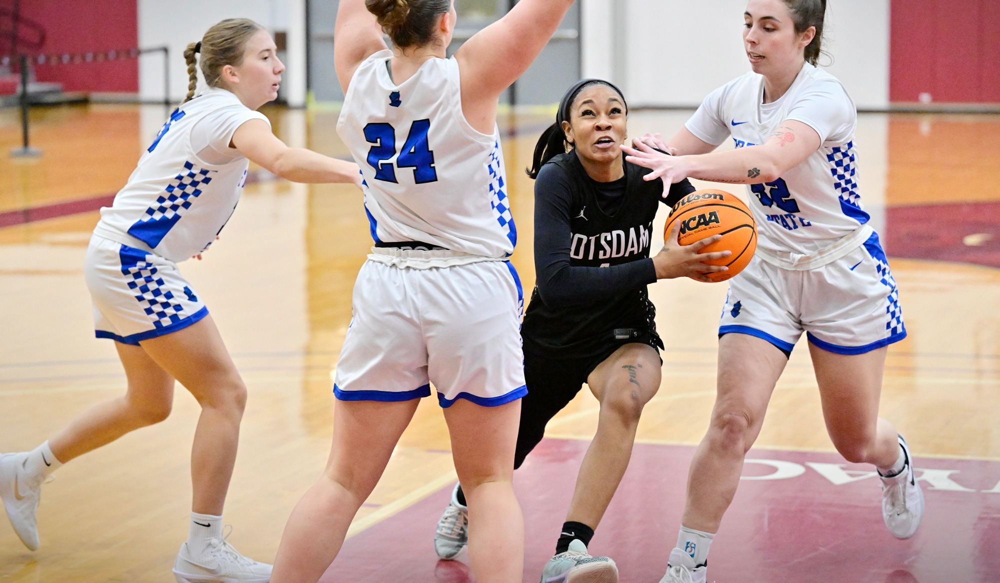 Xy'El Bradford drives to the basket against Fredonia on 12/6/25.