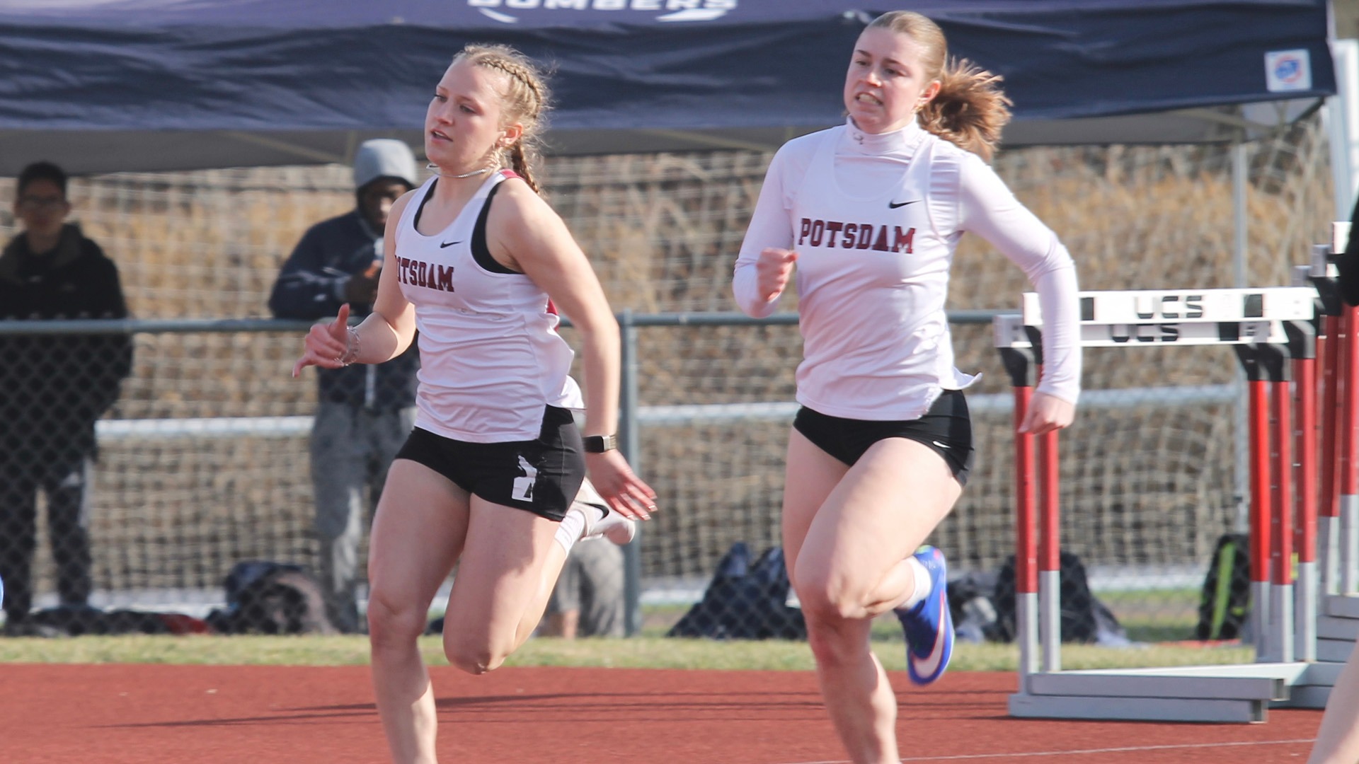 Emily Yousey and Madison Wagner run at the Cortland Red Dragon Open on 4/4/25.
