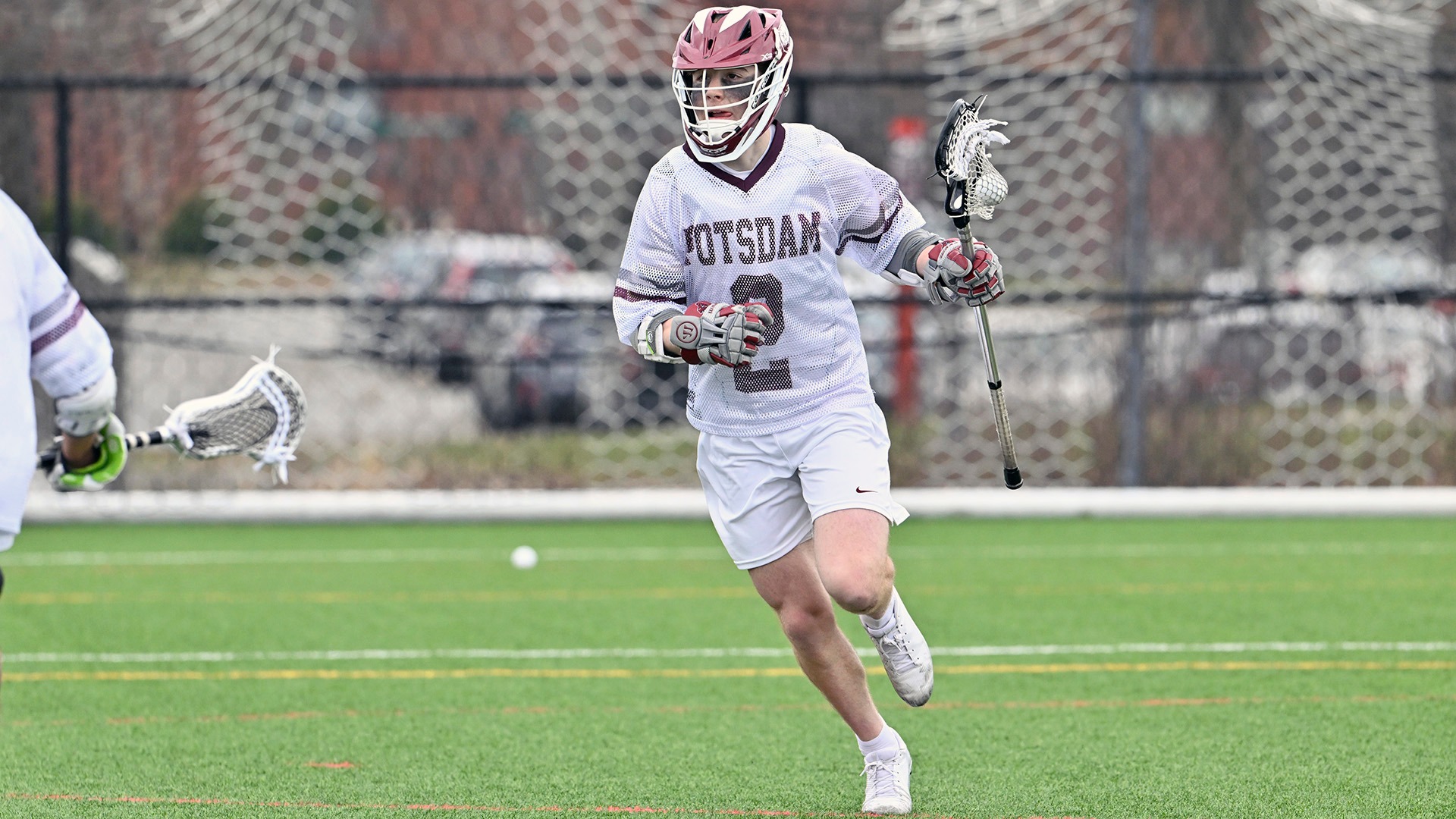 Ryan Hughes carries the ball against Oneonta on 4/12/25.